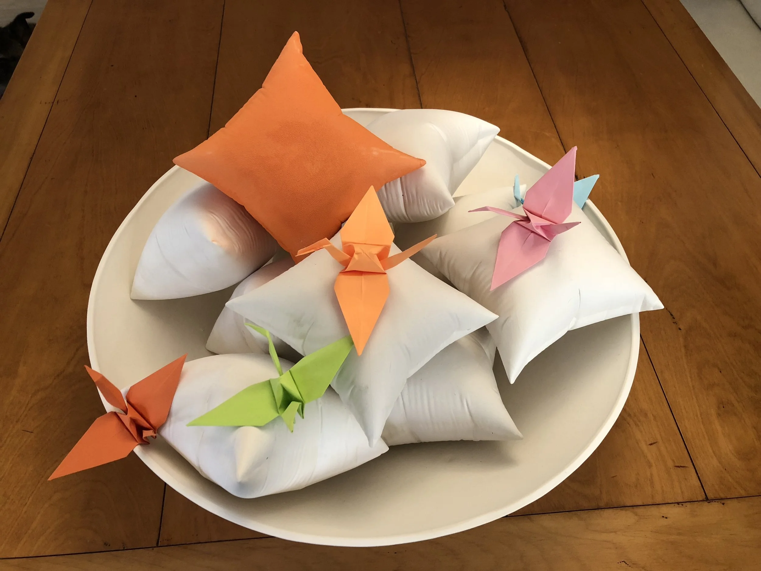 bowl of pillows with birds