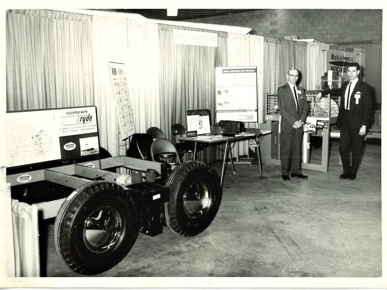   Company founder Bob Moore, Sr., right, with father, Gregg Moore, left, at a Sales Show  