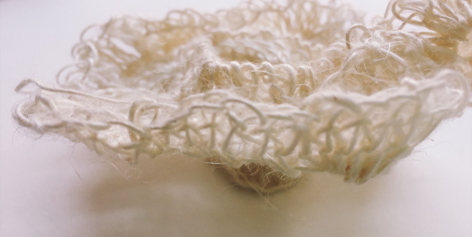 Self-Bracing in the Pseudosphere with a Tunisian Stitch