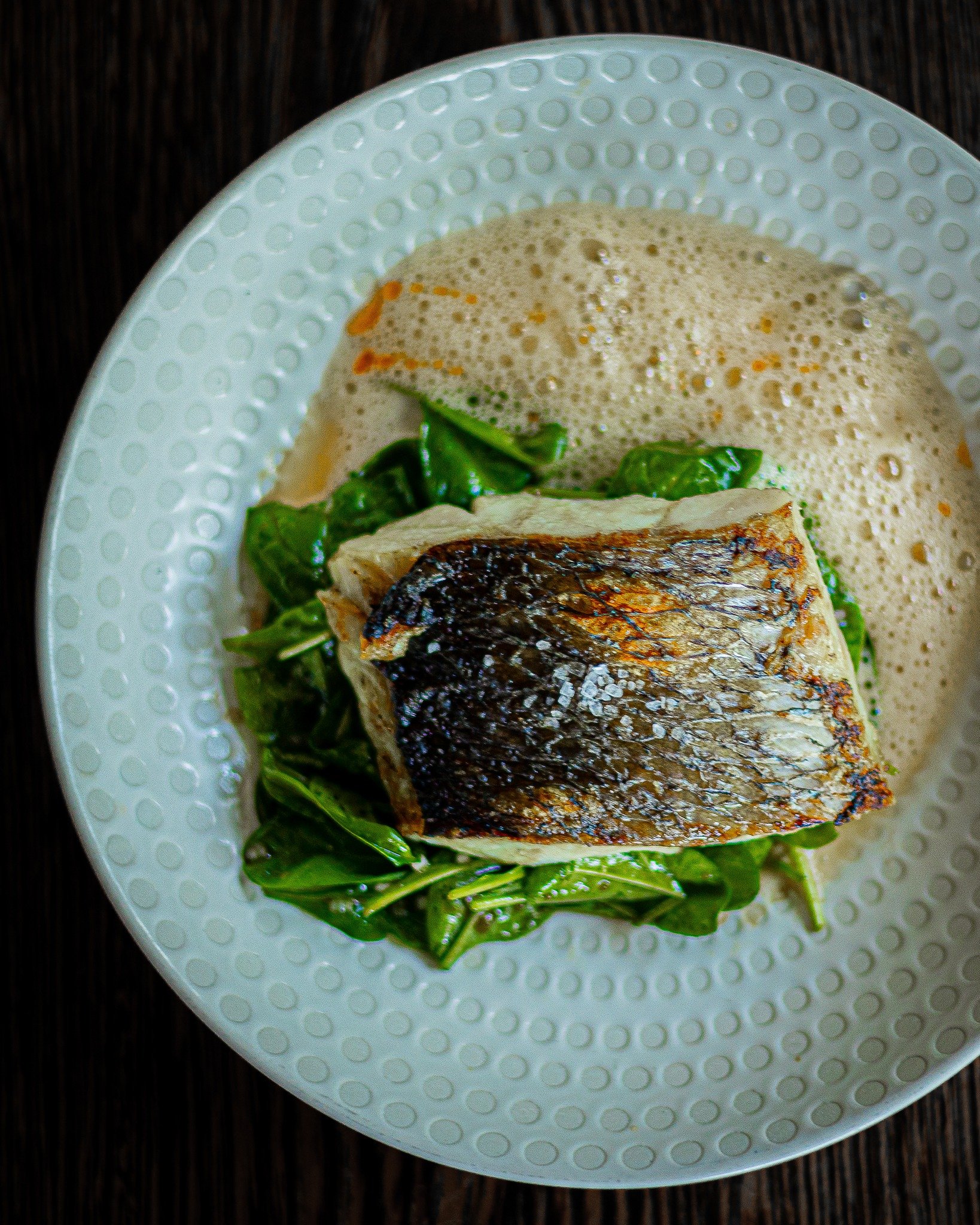 One of our all-time favourites, still on the menu for just a little while longer.
Seabass with chili butter and spinach &mdash; the kind of dish we&rsquo;ll miss too.
.
.
📸 @striktly_social 
#seabass #chilibutter #woxmoments #farewellflavours #thefi
