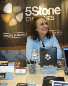 Joyce Zwirkoski, bottled water and assorted booth goodies. 