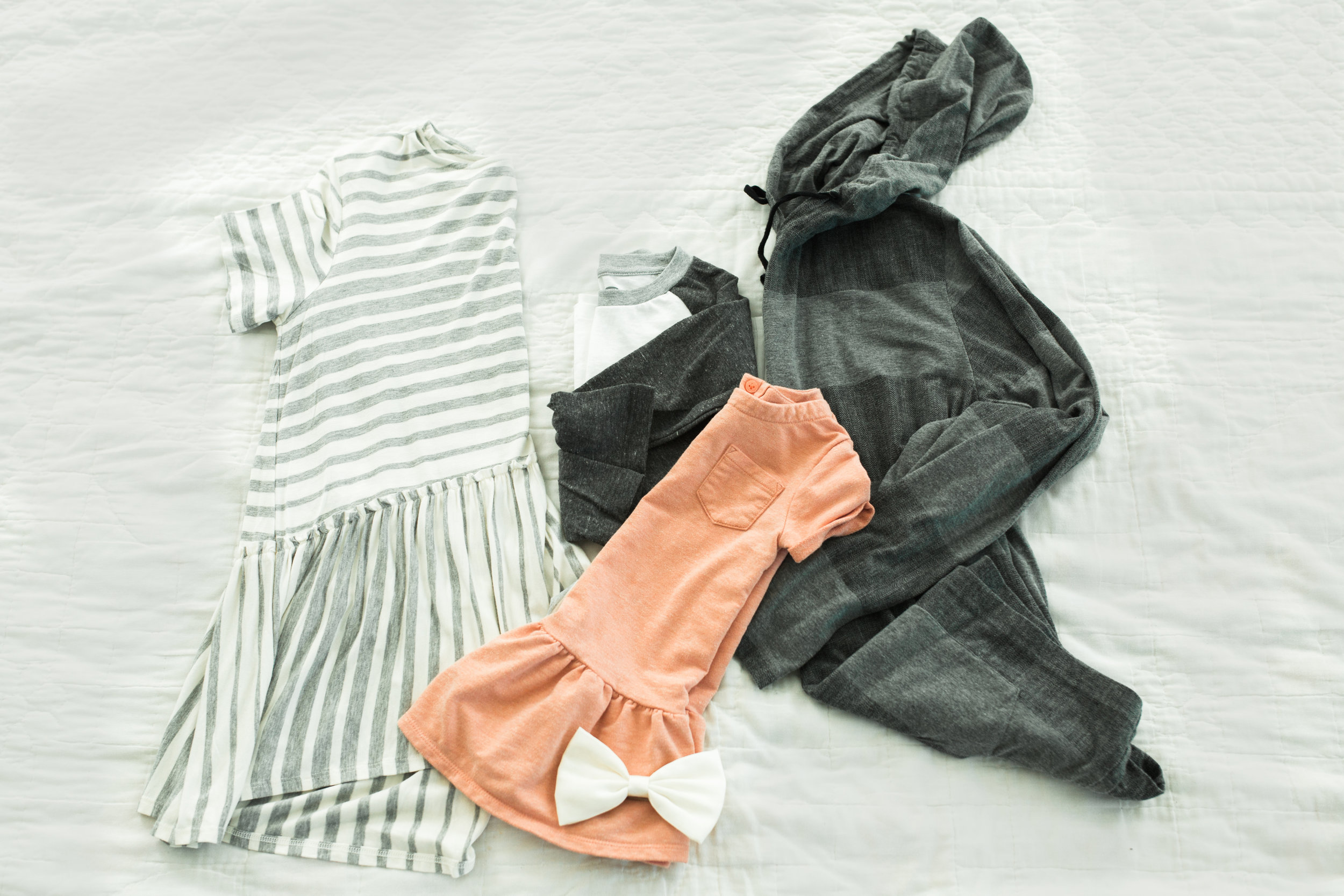 Mom in adorable flowy striped tee. I would wear with olive cargo skinny pants (which I am on the HUNT for! That's my family photo outfit this year!) Baseball tee again for boy. Paired with jeans. Gray hoody for dad, paired with jeans. Coral dress for girl, maybe with camo leggings (my daughters were in the wash or they would be pictured!) .