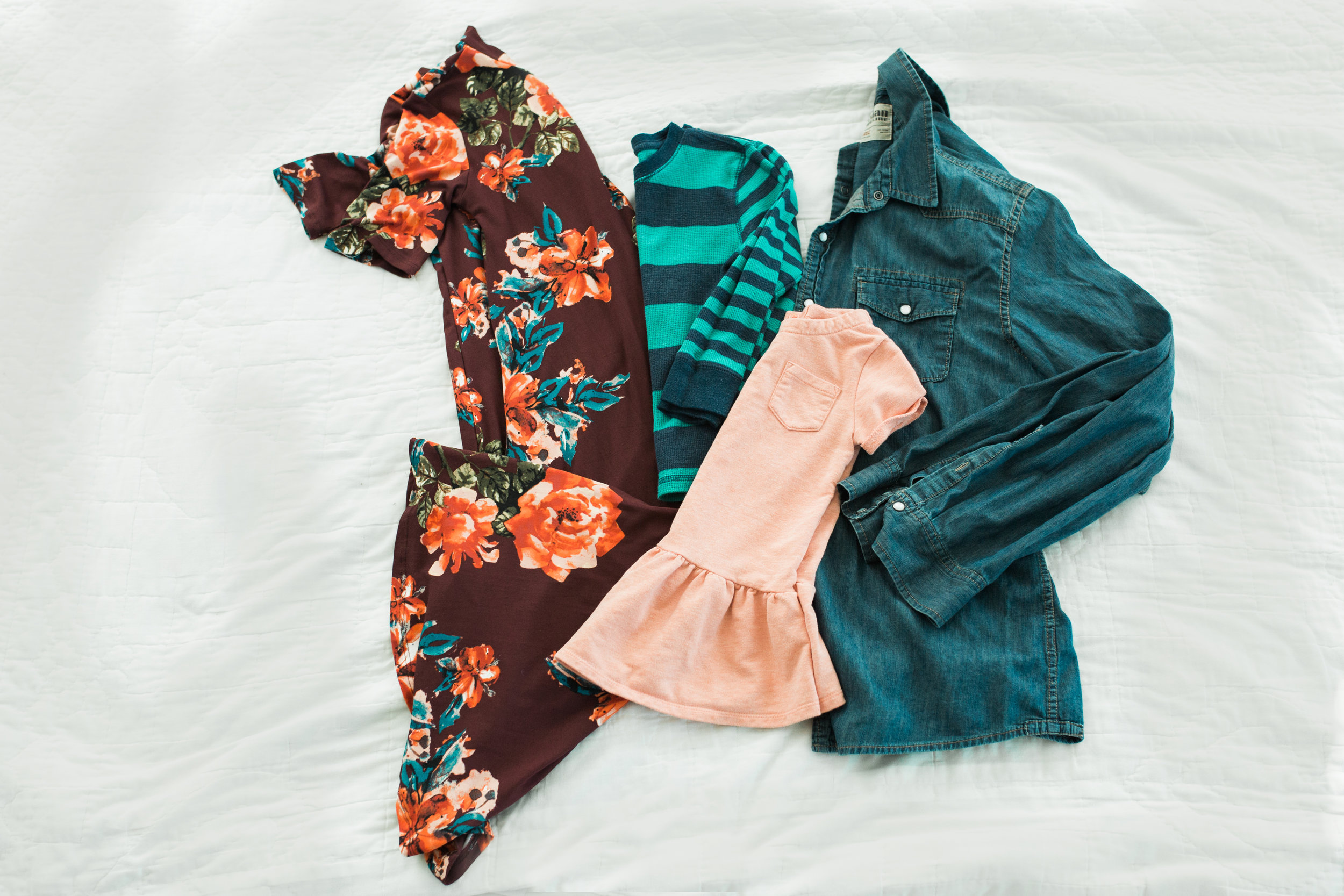 This is a very colorful arrangement. My only one this bright. Fun floral dress for mom, with ankle boots. Girl in complimentary coral dress, maybe with matching headband. Boy in striped aqua/navy thermal (colors in moms dress). Dad stays neutrtal in chambray shirt and khakis.