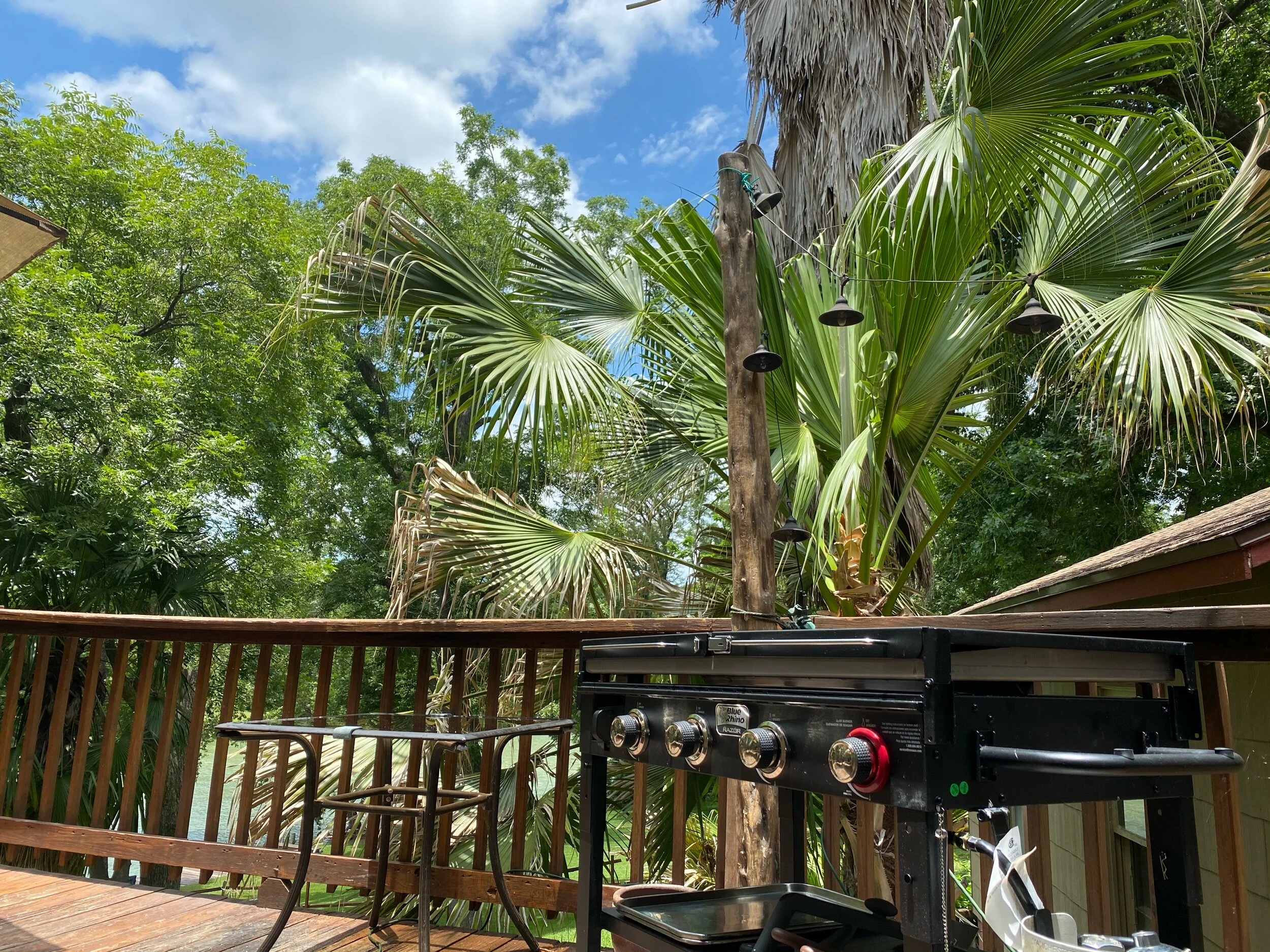 Propane BBQ Griddle. 1 tank is hooked up and a spare is on the side. 