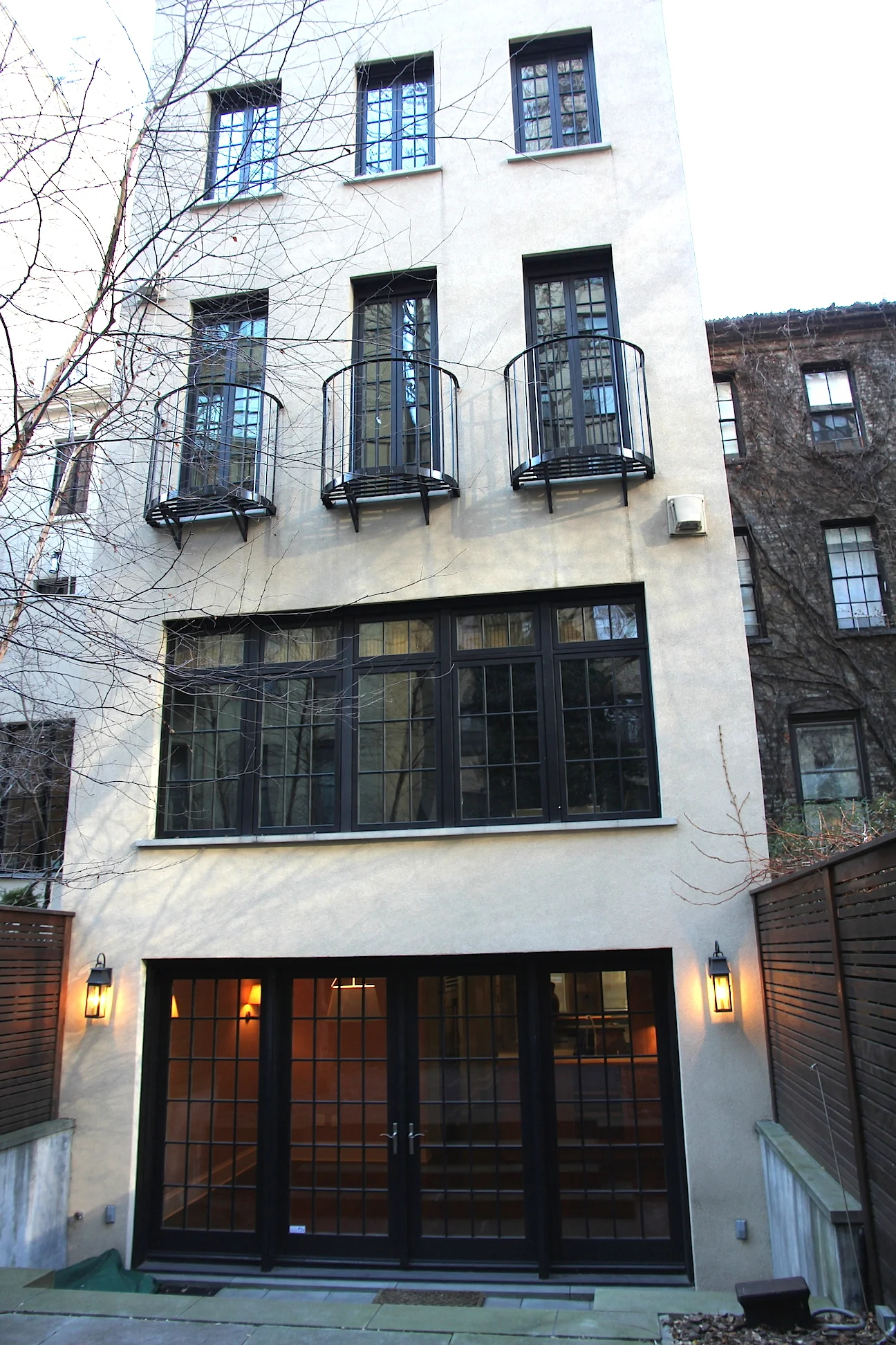 Full renovation of a townhouse with a four-story addition in the back. The parlor floor has a refined elegance with new windows, mouldings, pocket doors, and a library with a wall of windows overlooking the redesigned garden below. All fireplaces were updated to modern standards. The master suite includes juliet balconies with french doors, a large dressing room, and a five fixture bath with a custom built double vanity. Structural Engineer: Robert Silman Associates, P.C. Landscape Architect: Todd Rader & Amy Crews Interior Designer: Bilhuber & Associates Kitchen: Smallbone of Devizes 