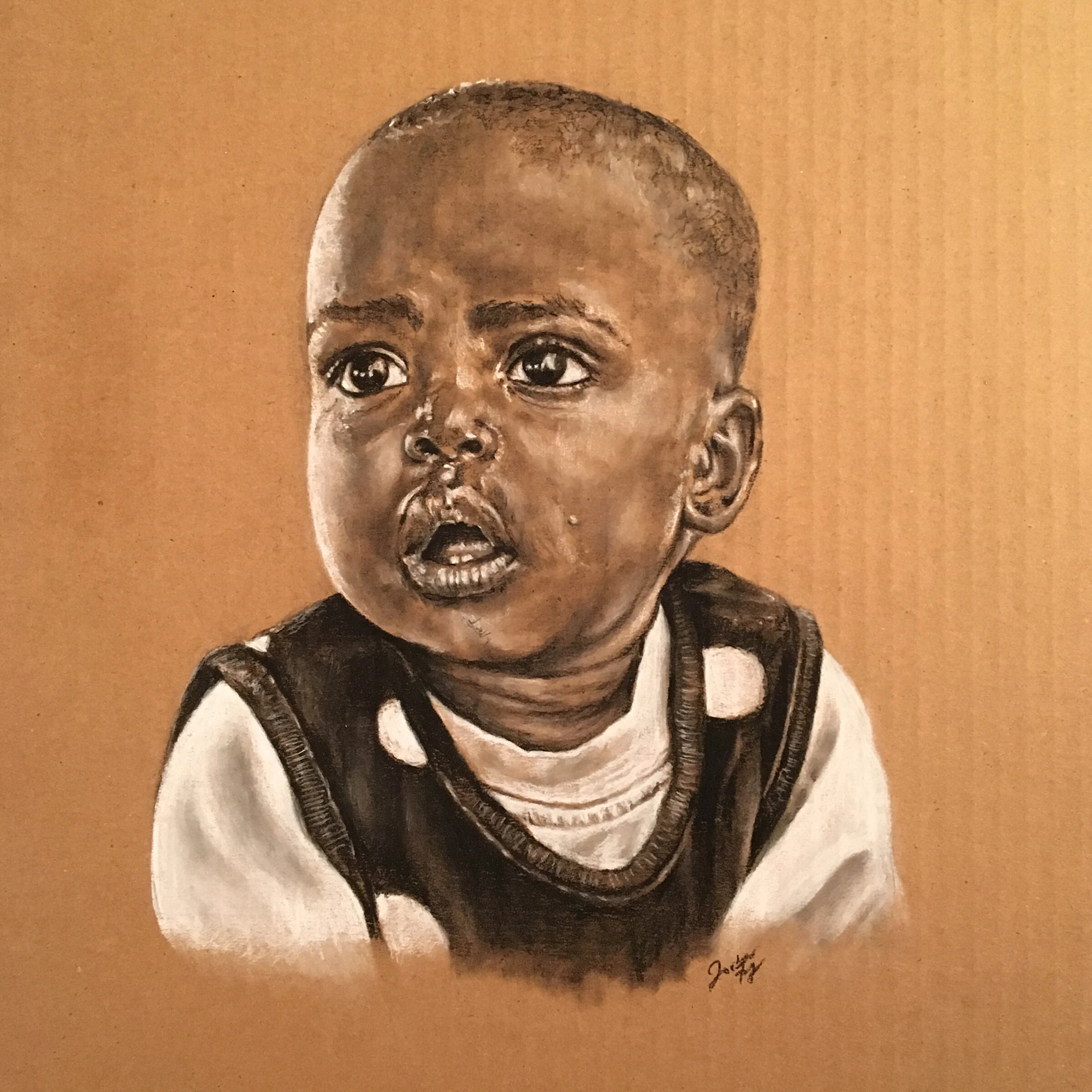 african-boy-portrait-in-charcoal-on-cardboard-by-jordan-fretz.jpg