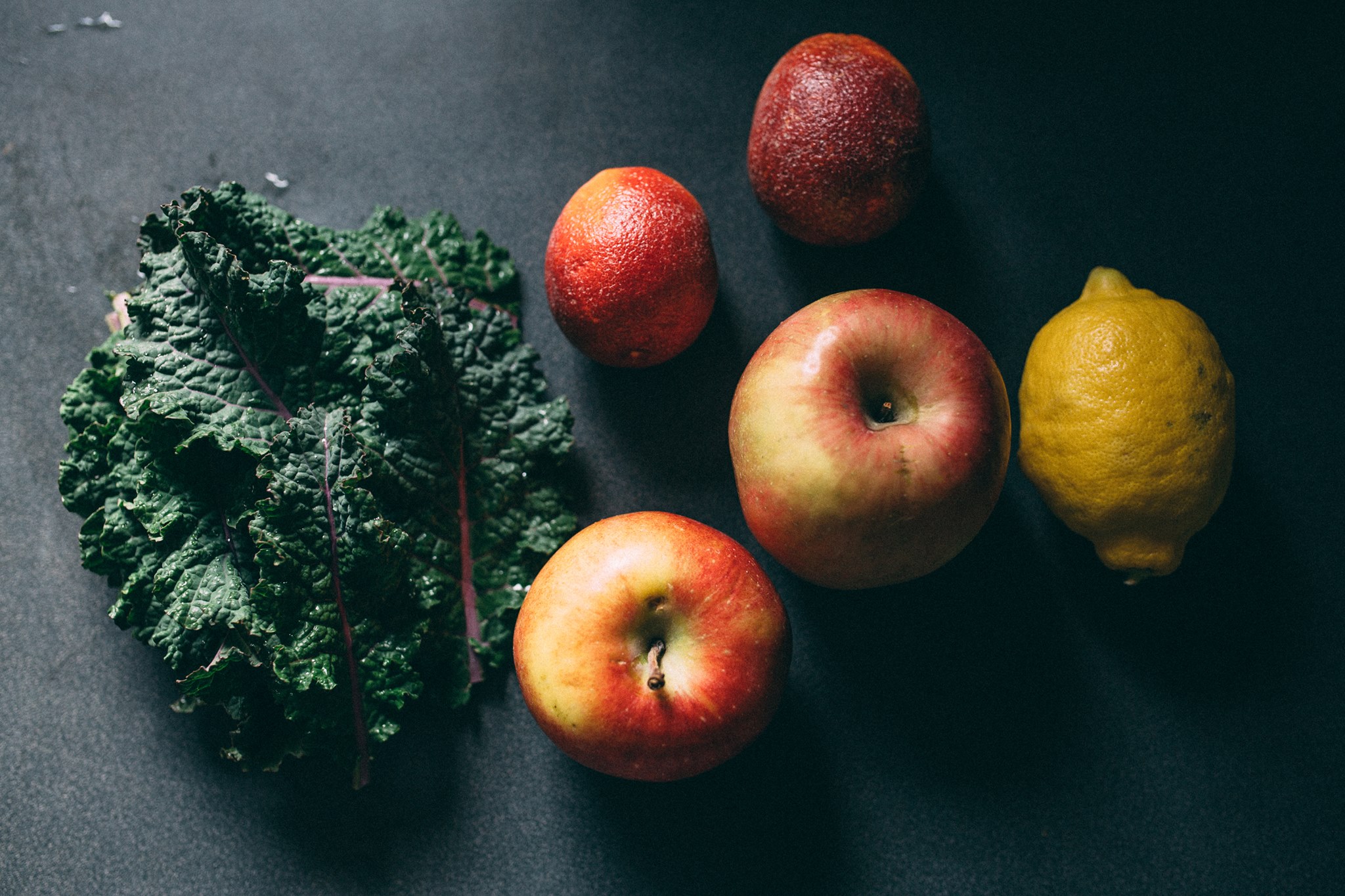 Morning juice ingredients: kale and apples, courtesy of my garden. The lemon and blood oranges, sadly, from some place much more sunny.