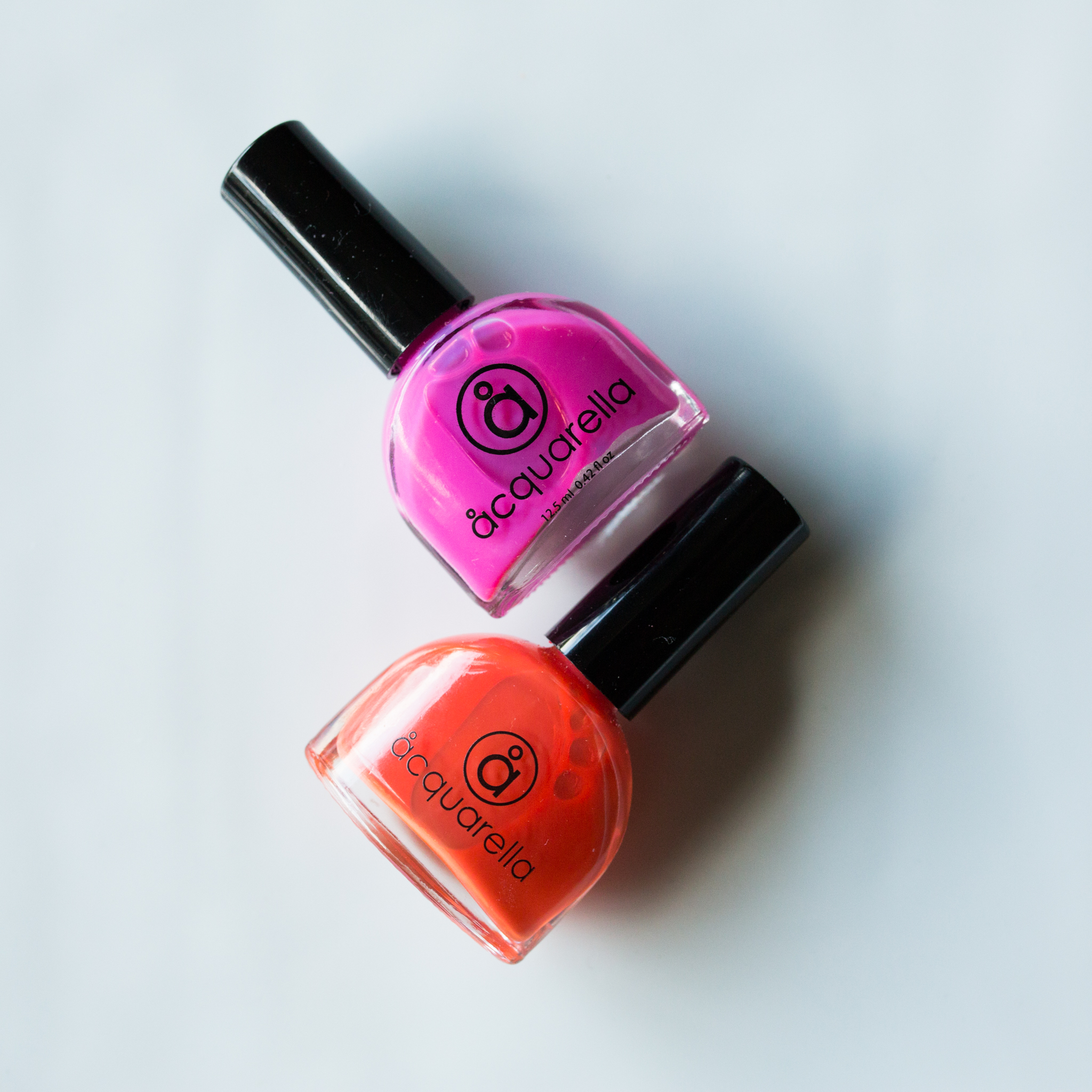 Aquarella Nail Polishes in Tickle Me and Cameo.
