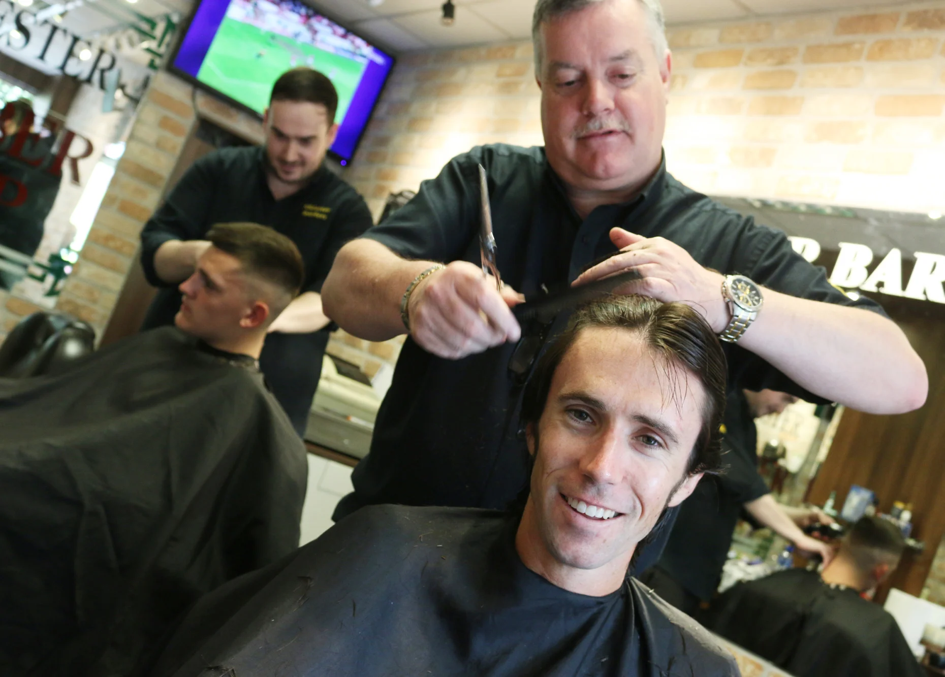 Olympian Mick Clohisey gets his haircut at Killester Barbers. Mick will be participating in the Men's Marathon on August 21st at this year's Olympics in Rio de Janeiro. Photo taken June 10th 2016. Thanks to Derek and Dave at Killester Barbers for allowing me to take the photo. 
