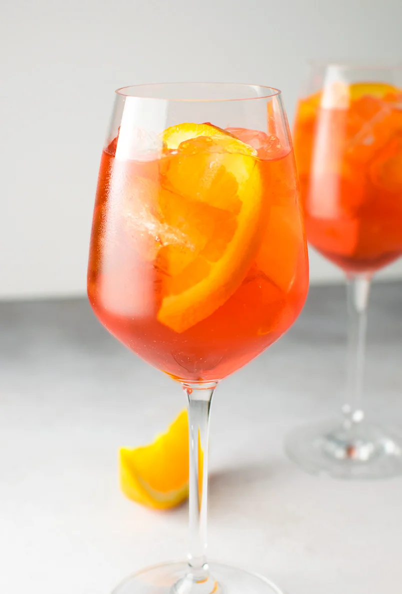 Photo and recipe by Kitchen Swagger. There is no denying that the classic cocktail, the Aperol Spritz, has been making a huge comeback this season. We've seen it popping up on wedding day bar menus and are loving the reemergence of this classic drink.