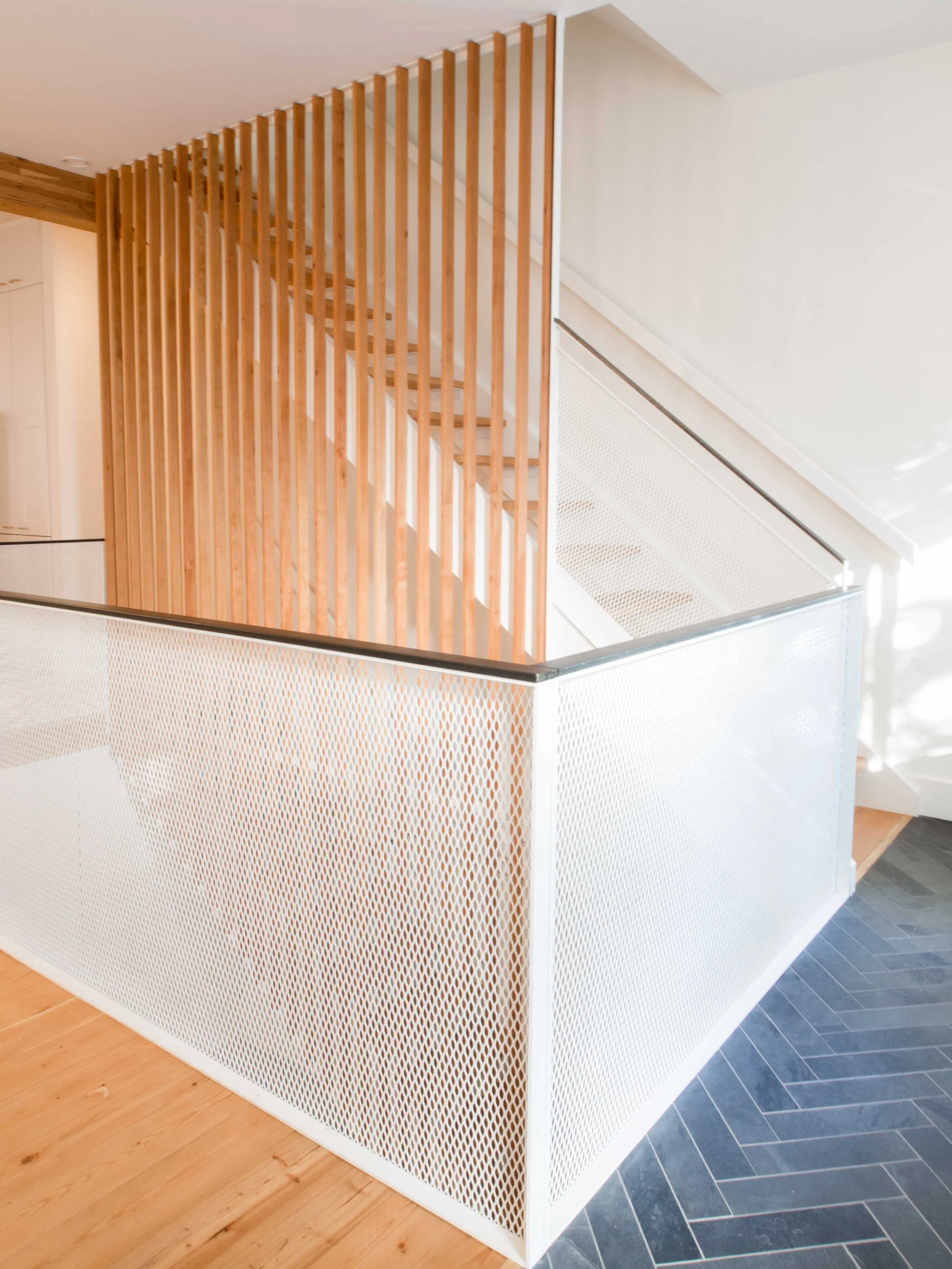  Renovation in Mile end Neighborhood in Montreal including opening up the groundfloor to the basement and creating a bridge to connect the spaces 