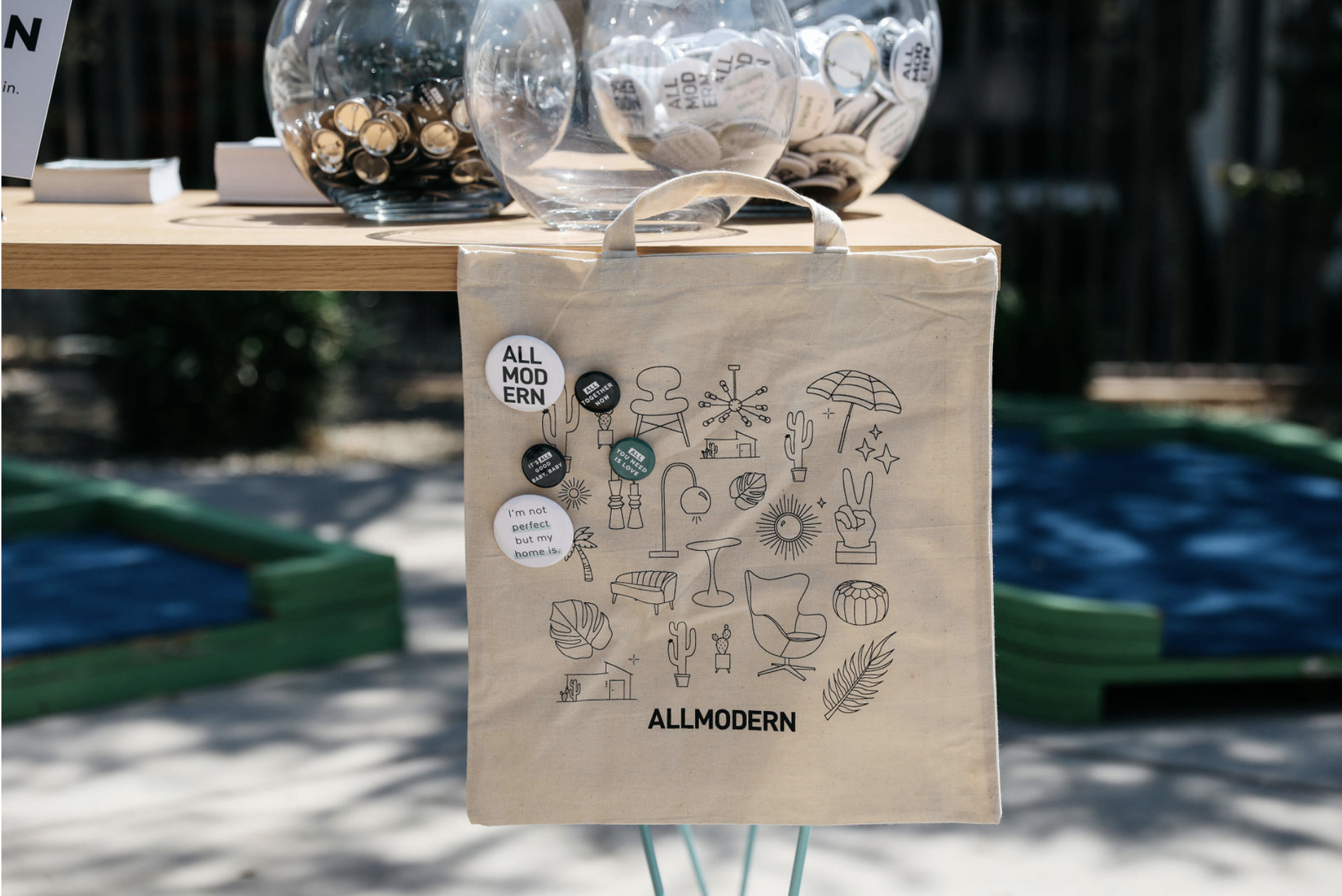 Welcome table with custom AllModern tote bag and pins. Image courtesy of Nicole Breanne.
