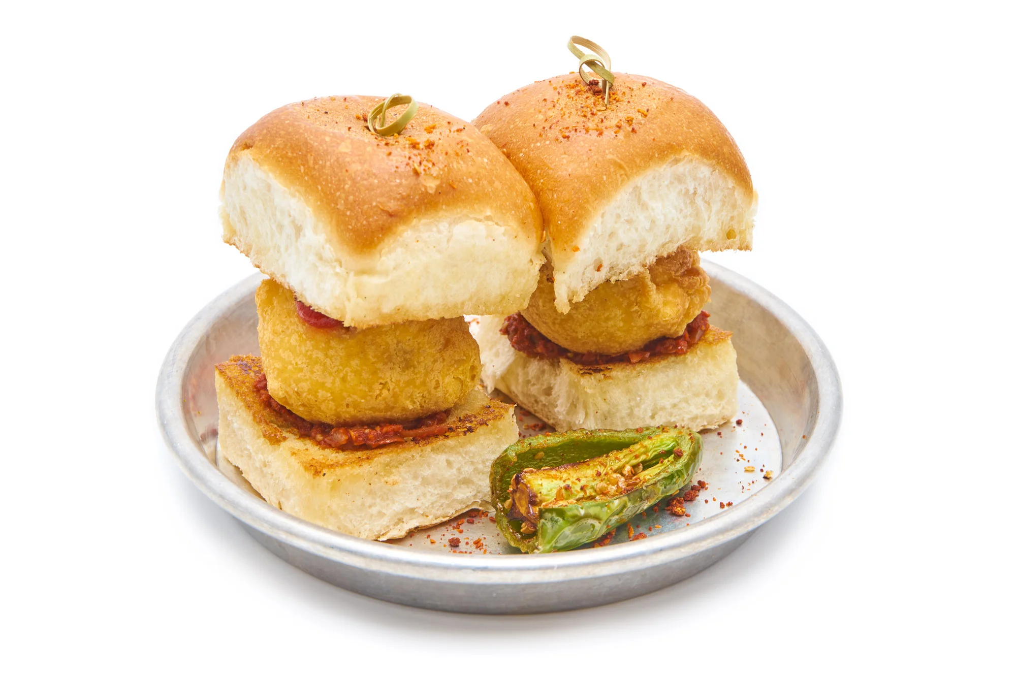 VADA PAV mashed potato fritter sandwiched between an amul buttered bun, garlic chutney, bombay dust (VG) (go butterless for V)