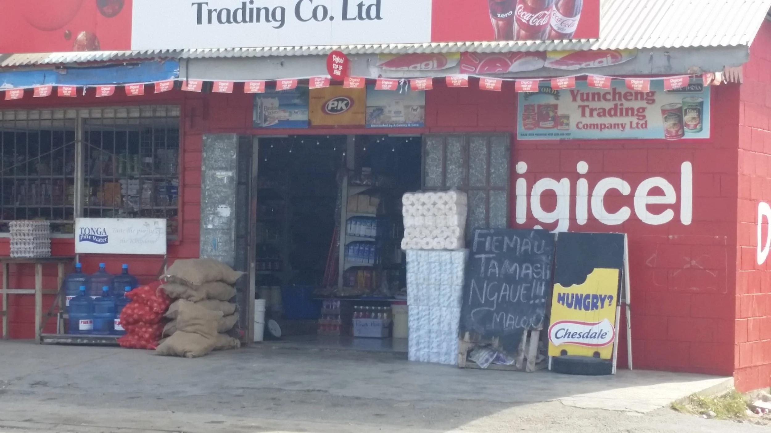 A small shop in the Tongan capital city of Nuku‘alofa with a “help wanted” sign sitting out front. Jobs like the one advertised here for a “shop boy” are often low-paying, further motivating youth to consider circular migration for employment. Photo credits: Author.