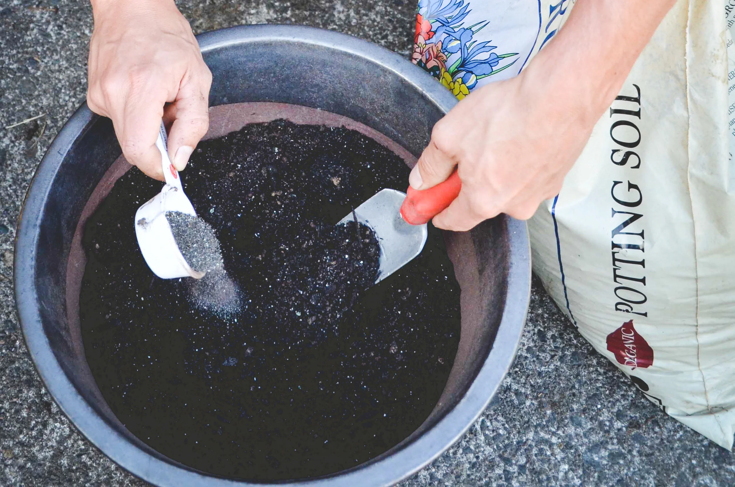Mixing fertilizer - p hoto by Seattle Urban Farm Company