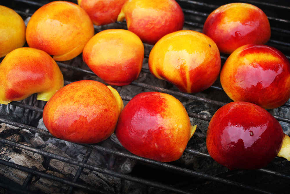   Grill the peaches, cut side down, on the hot zone of your grill for about 3-5 minutes on each side, depending on how much char you want.  