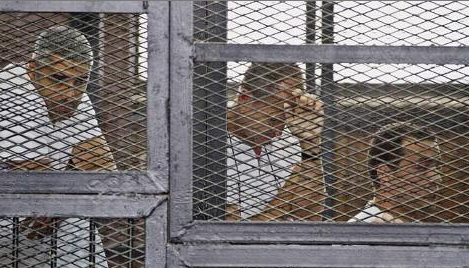 Al-Jazeera correspondents Peter Greste, Mohammed Fahmy and Baher Mohammad.