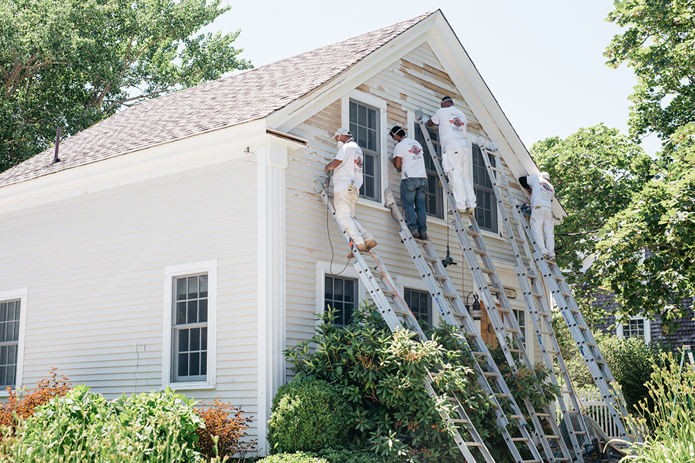 A house getting a fresh coast of timber in Chatham, Cape Cod. 