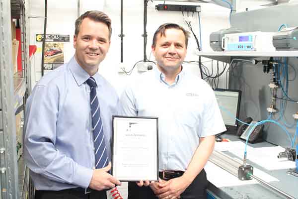 Tidyco’s production manager, Phil Mason receiving the Pneumatic cylinder manufacture approvals certificate from Dean Taylor of Parker Hannifin