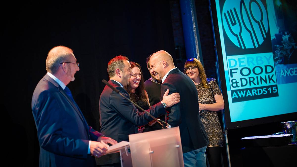 David Torrington from sponsor Sky Recruitment Solutions presents winner of Best Out of Town Angelo's The New Inn in Belper with their award