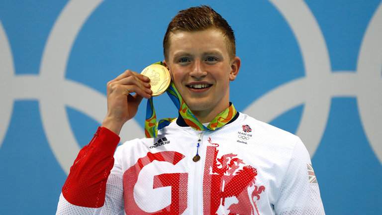 Peaty accepts the first gold medal for Team GB at the Rio Olympics