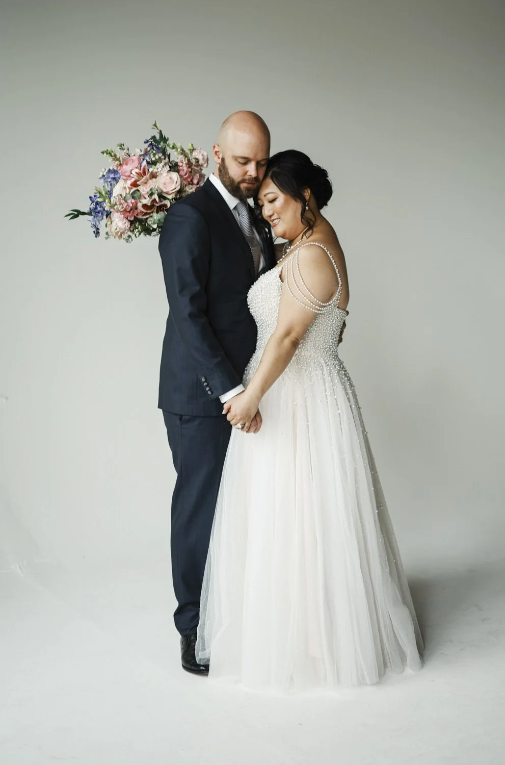 bride in studio on her wedding day photography session