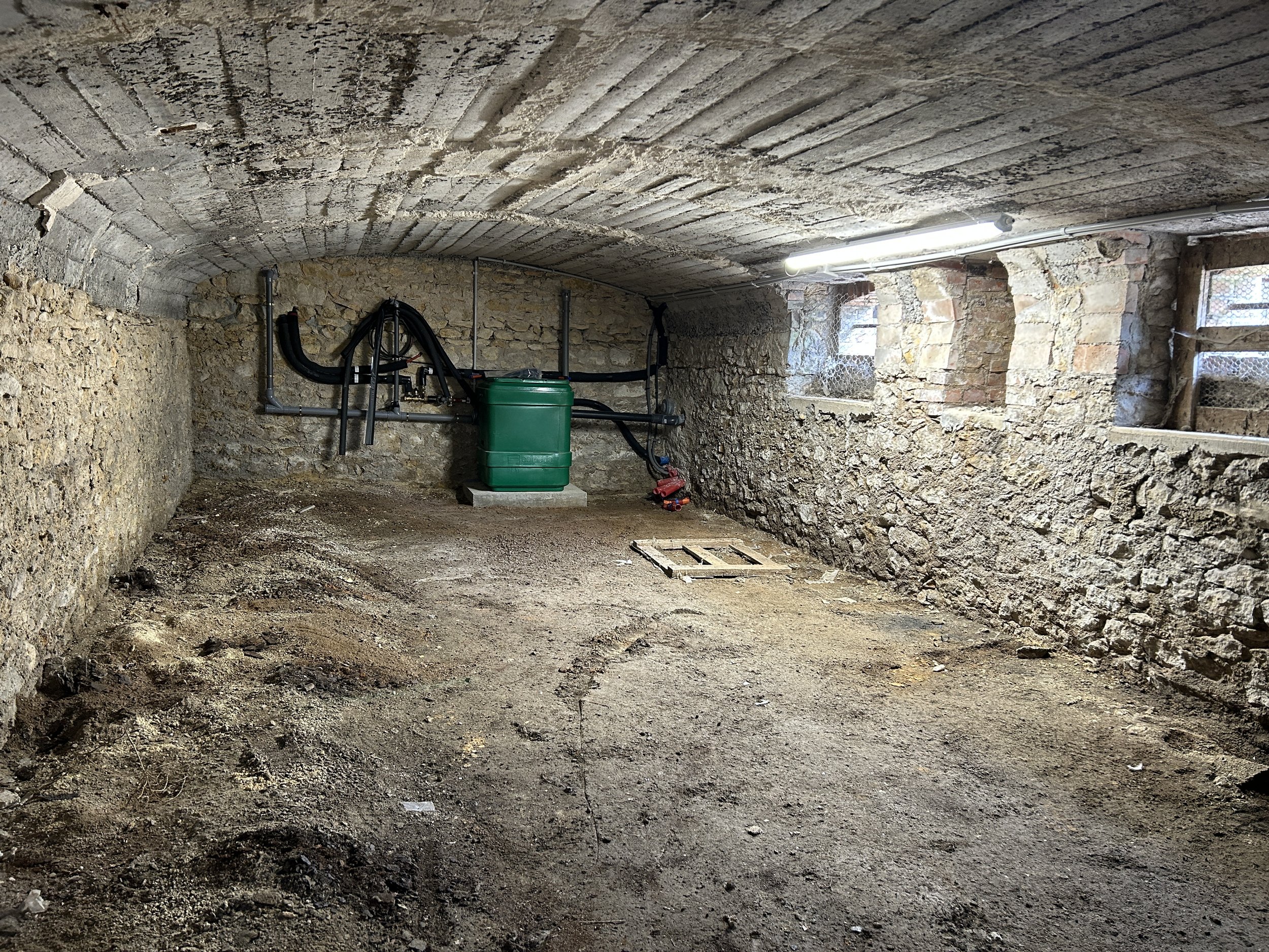  The cave emptied out. In the background is the sump pump to remove water from the sink above it in the printshop. 