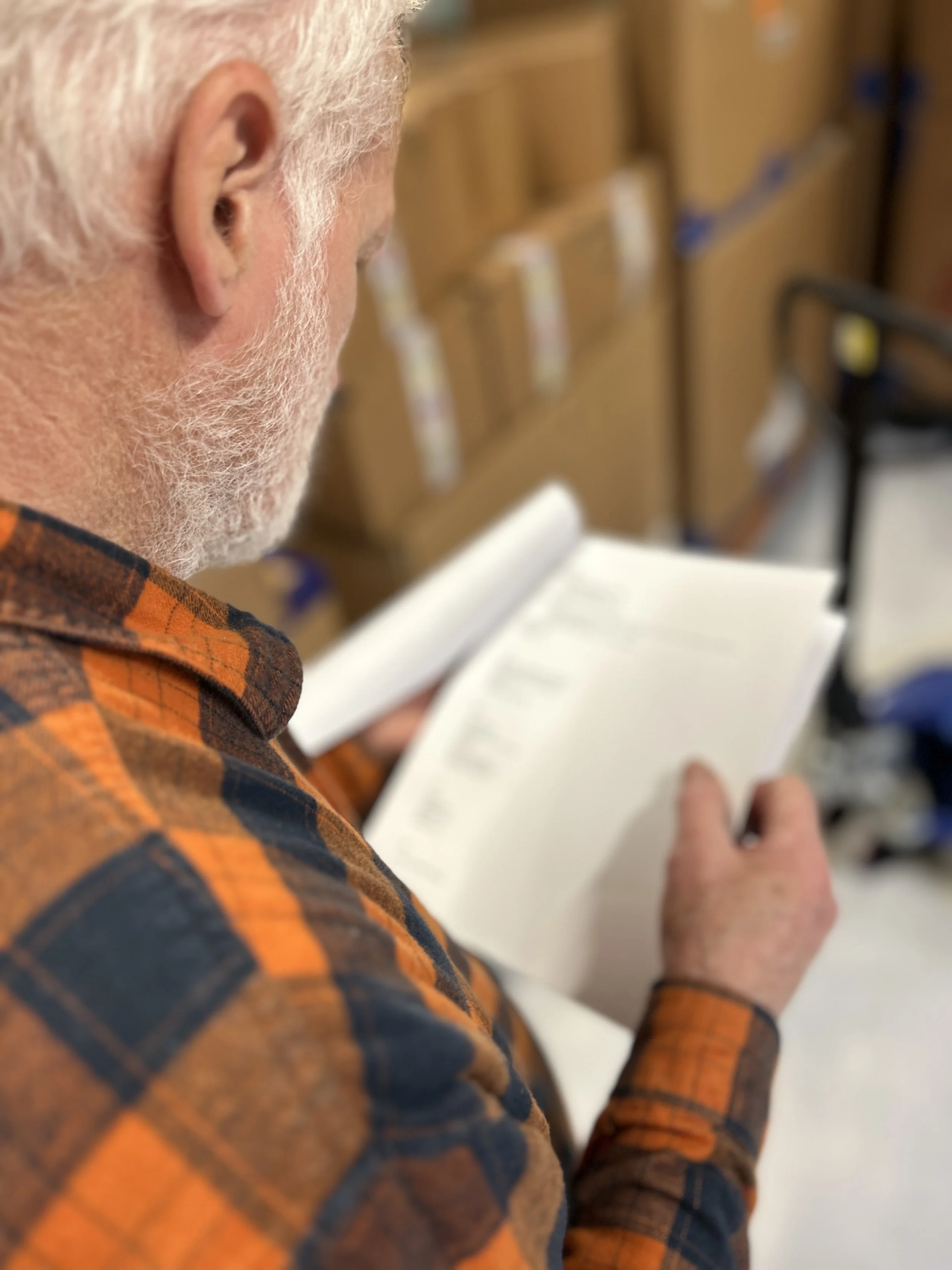  Reading the inventory list to make sense of the array of boxes that arrived (container #1). 