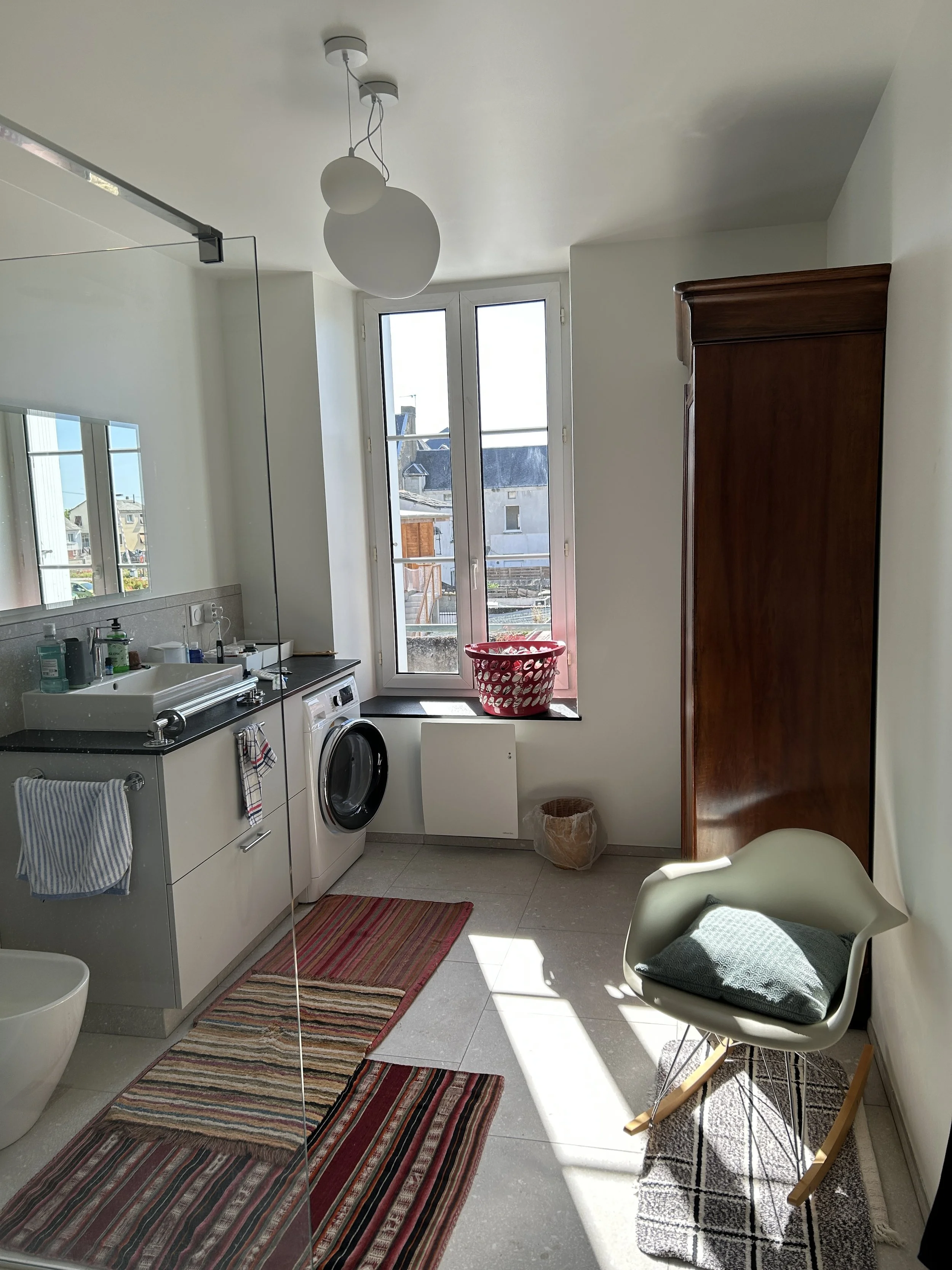  An armoire, a shower, and a chair - beginning to feel a lot like home. 