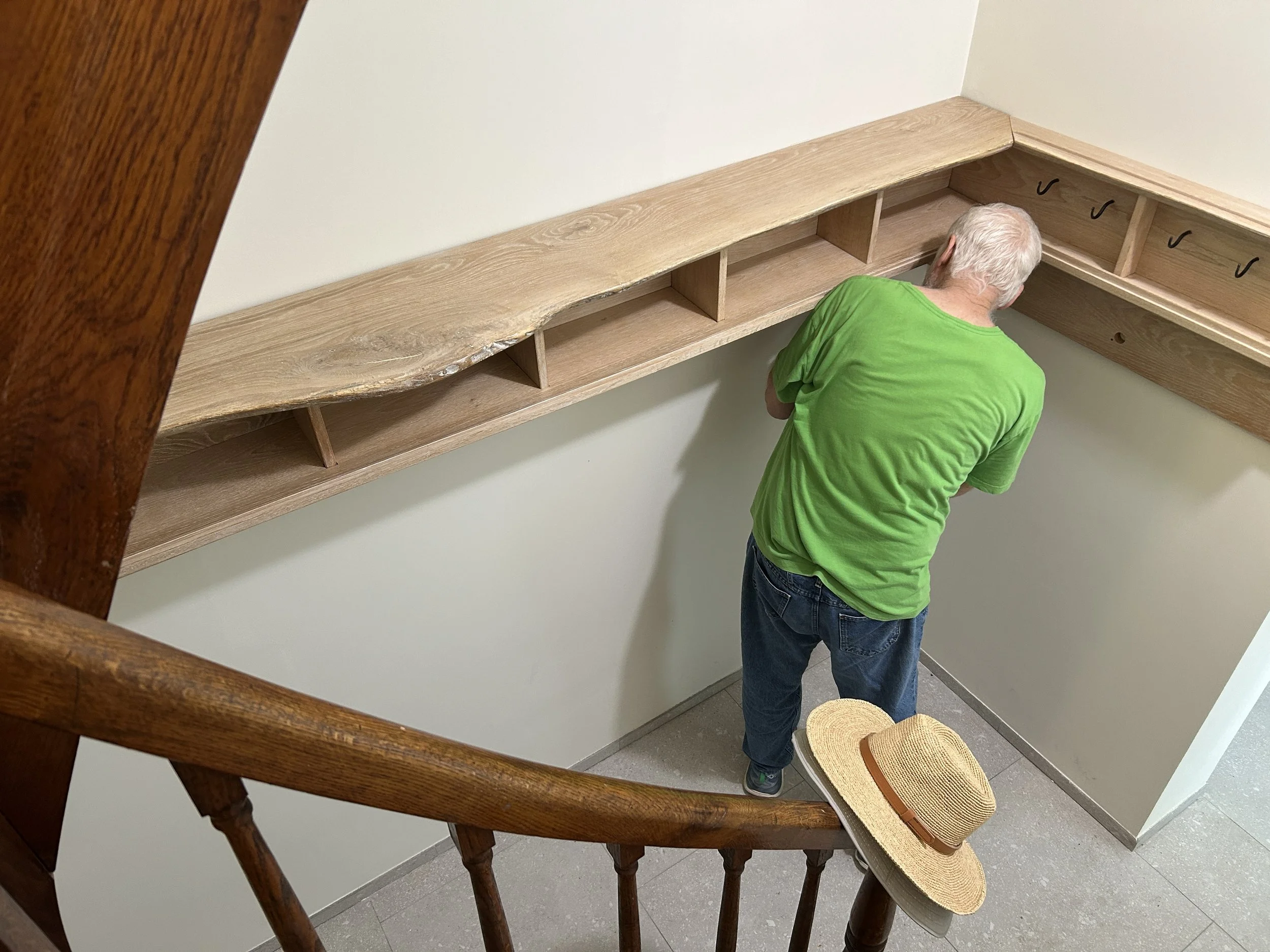  Alain installing some much needed storage with a beautiful set of shelves and cubbies he made in Petersburg. 