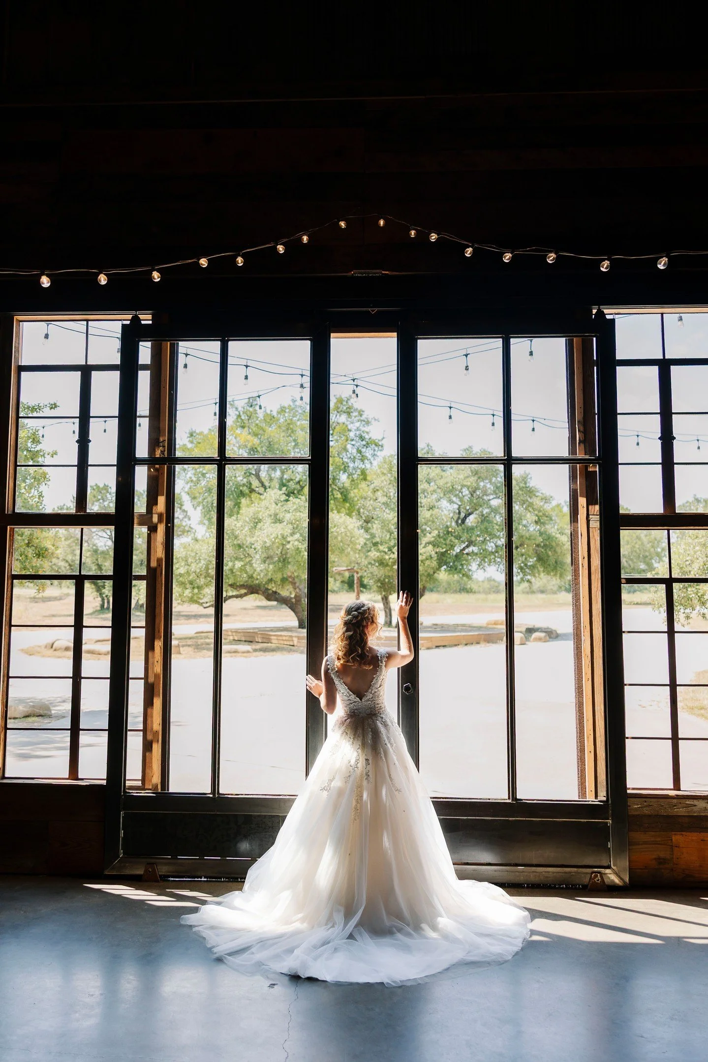 Gorgeous and romantic indoor ceremony for Kaylee and Joshua! Our doors are handmade by my dad from repurposing old windows into doors -- we love them and they are the perfect backdrop to give ☀️summer brides the outdoors during ceremony! 

Photos by 