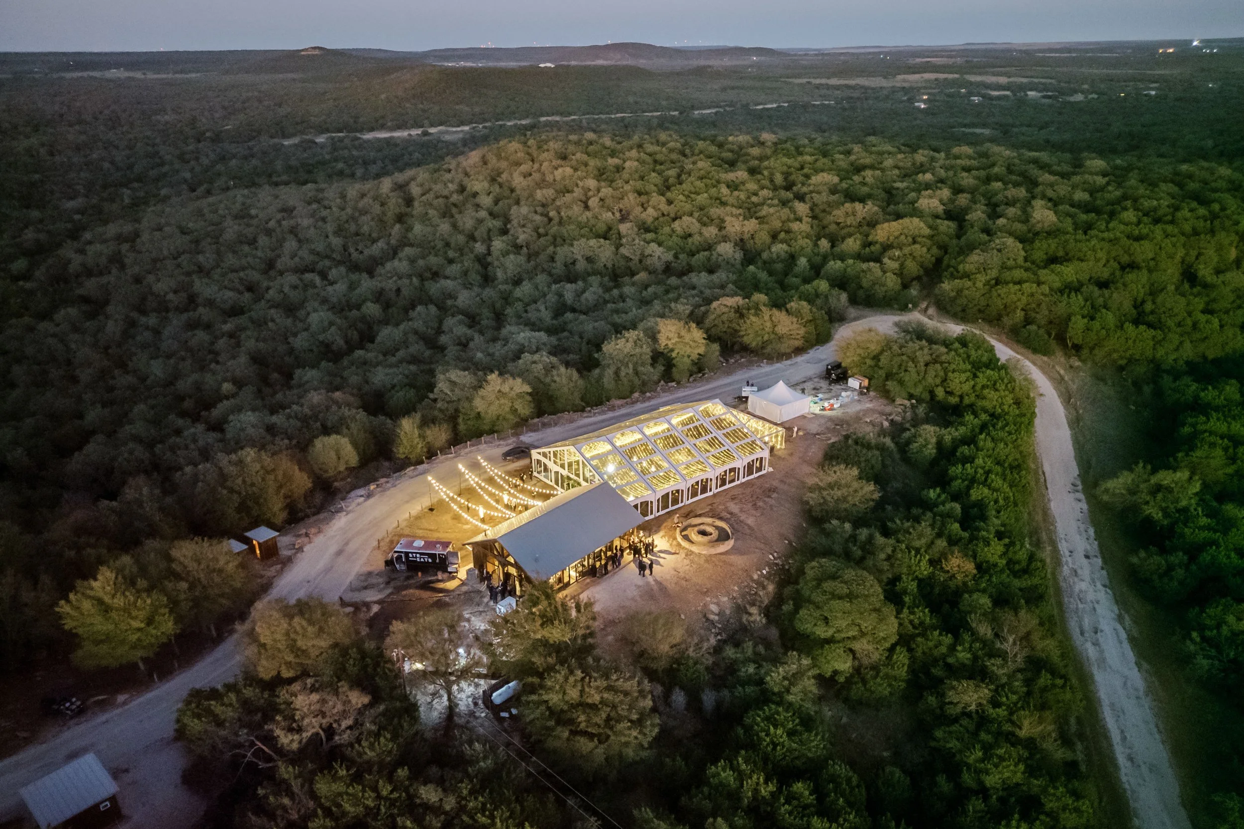Luxury ranch wedding with tent and twinkle lights at Wildcatter Ranch and Resort near DFW for stunning wedding planned by Mayfield Events.