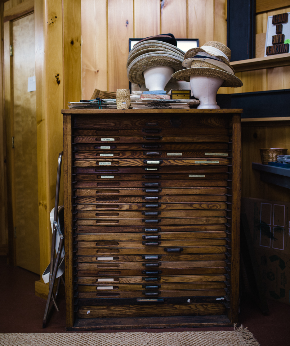 Wood-type cabinet in the shop beneath the lighthouse.
