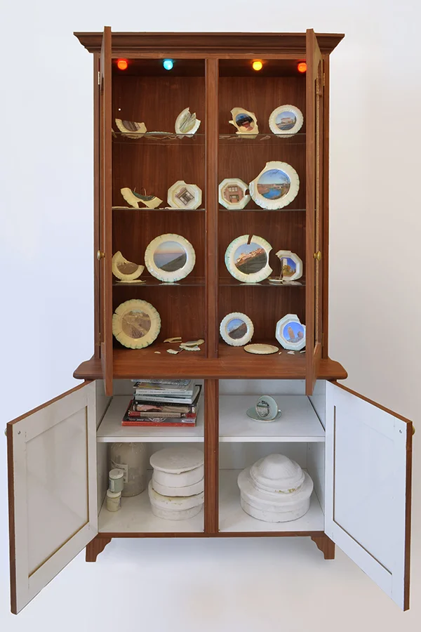faux wood laminated flake-board, porcelain, decals, light bulbs, books, plaster 2010