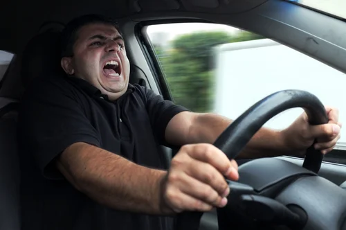 Bad traffic + an uncomfortable car = this guy. You don't need to be this guy. (Stock)