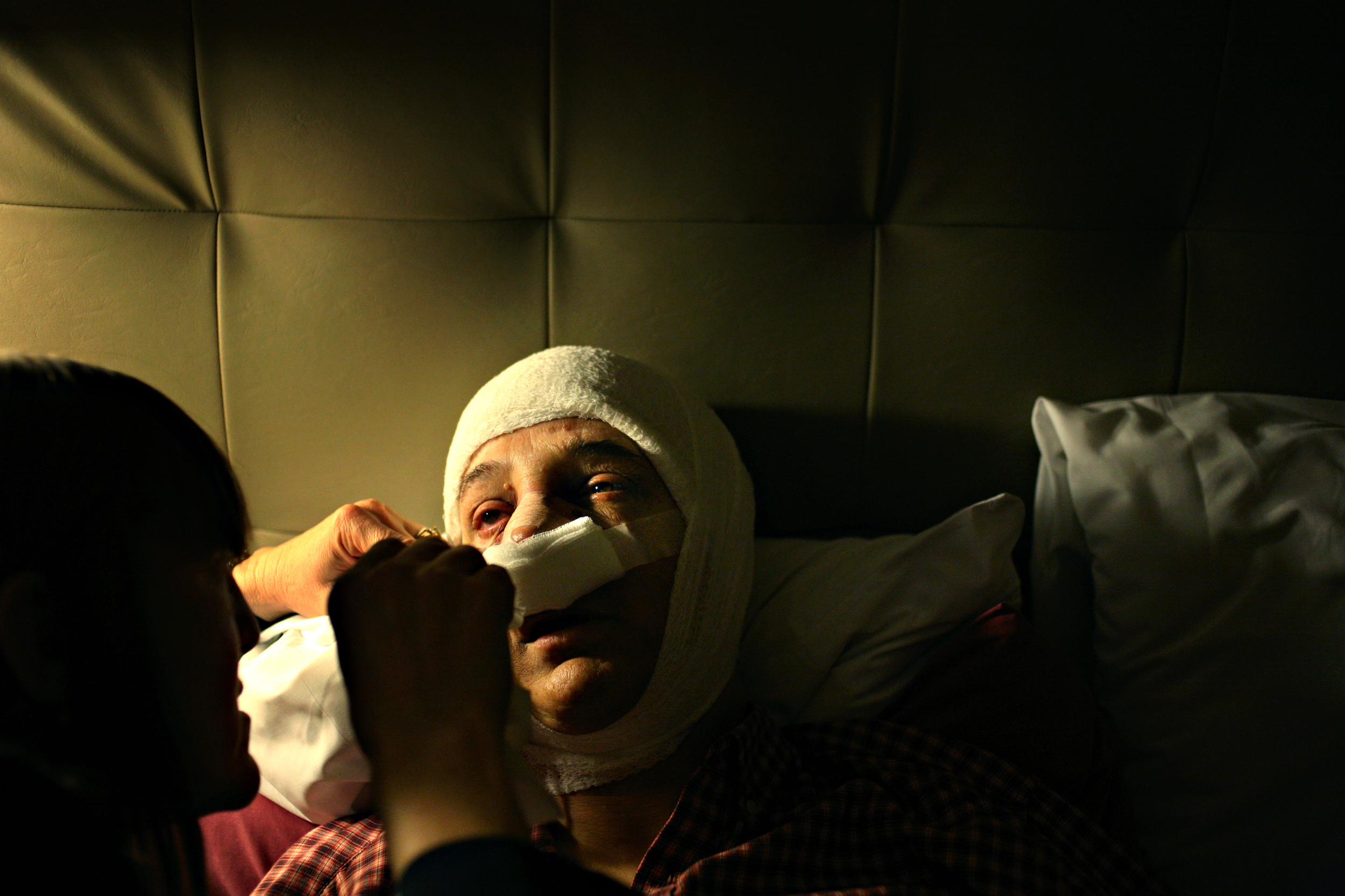  Elena tries to stay awake as her wife, Zing, changes her bandages after her facial feminization surgery.  In June 2008, Elena and Zing watched a movie,&nbsp; Ma Vie en Rose , about a Belgian boy coming to terms with his gender identity. The movie tr