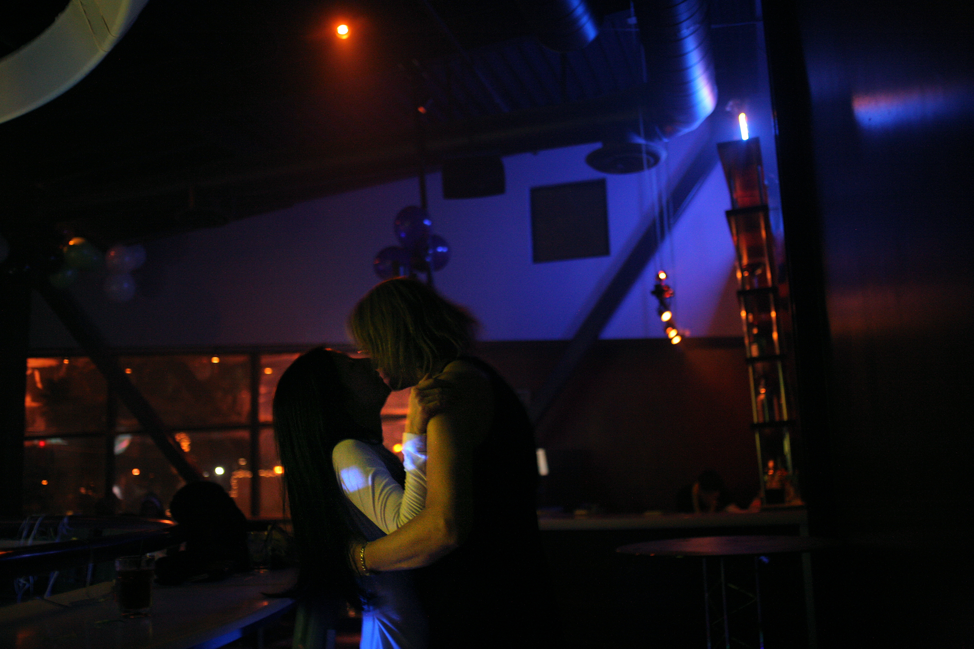 Elena celebrates New Year's with her friend Anna at Faces, a popular gay bar in midtown Sacramento. The two spent the night dancing, drinking, and sometimes kissing in the dark of the club's upper level.