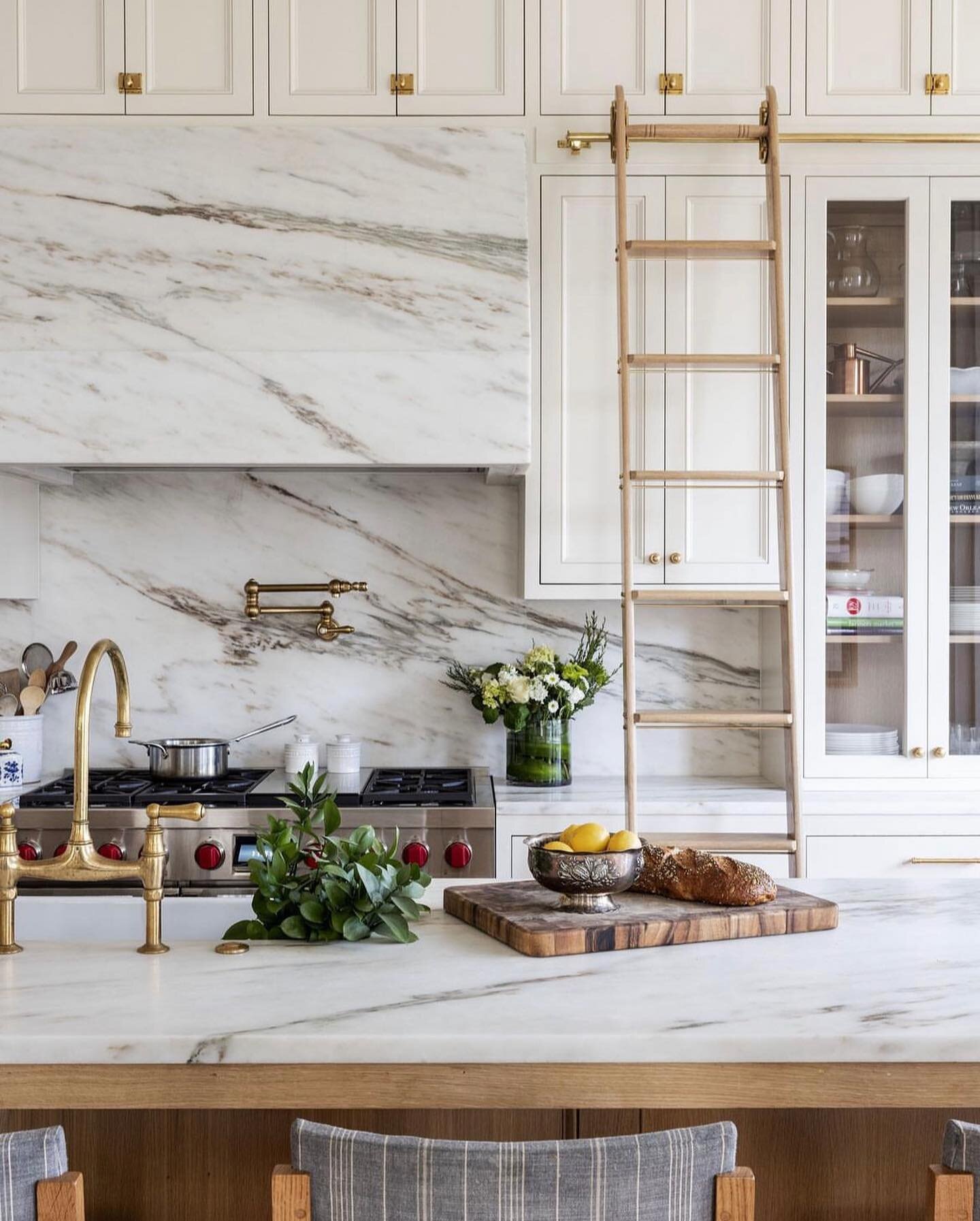 PROJECTS - Sneak peek of the completed kitchen at our State Street project! Full gut down to the studs with an addition and now all the details! Showstopper of a marble clad hood, slab backsplash, unlacquered brass hardware, ladder rail, glass front 