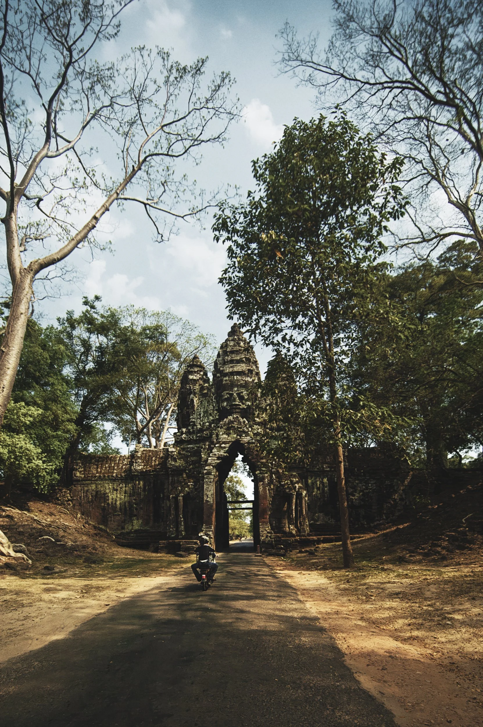 angkor-thom-south-gate-cambodia-traveler-motorbike-ancient-architecture.jpg