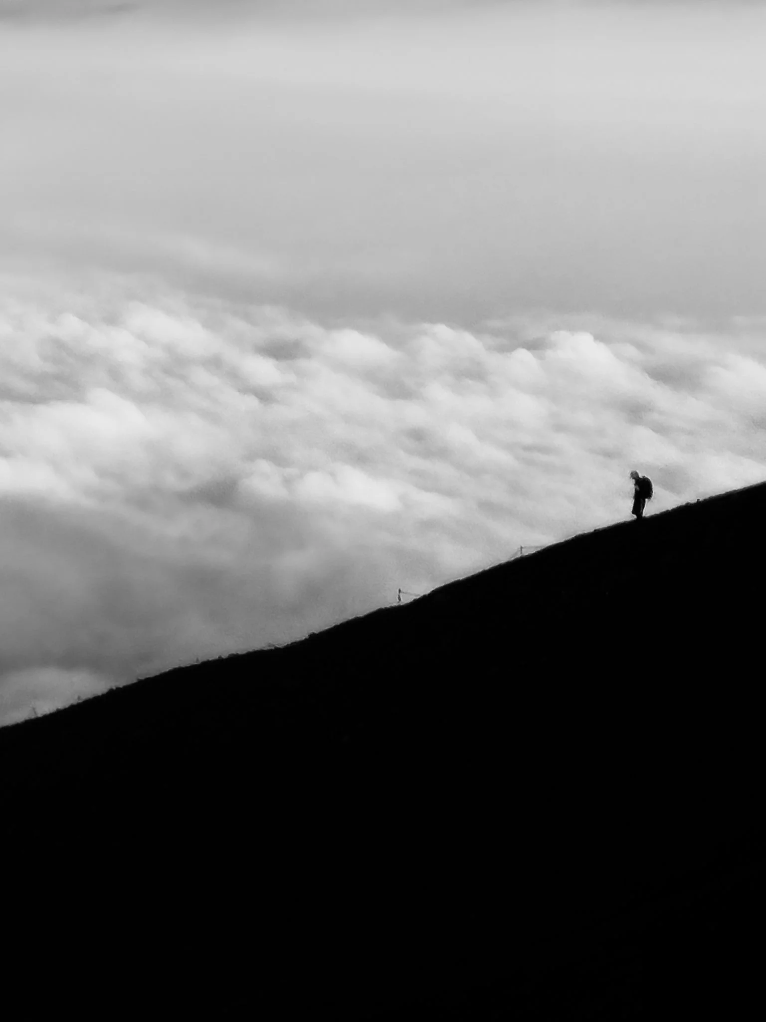 mount-fuji-climbing-silhouette-above-clouds-minimalist-landscape-bw.jpg