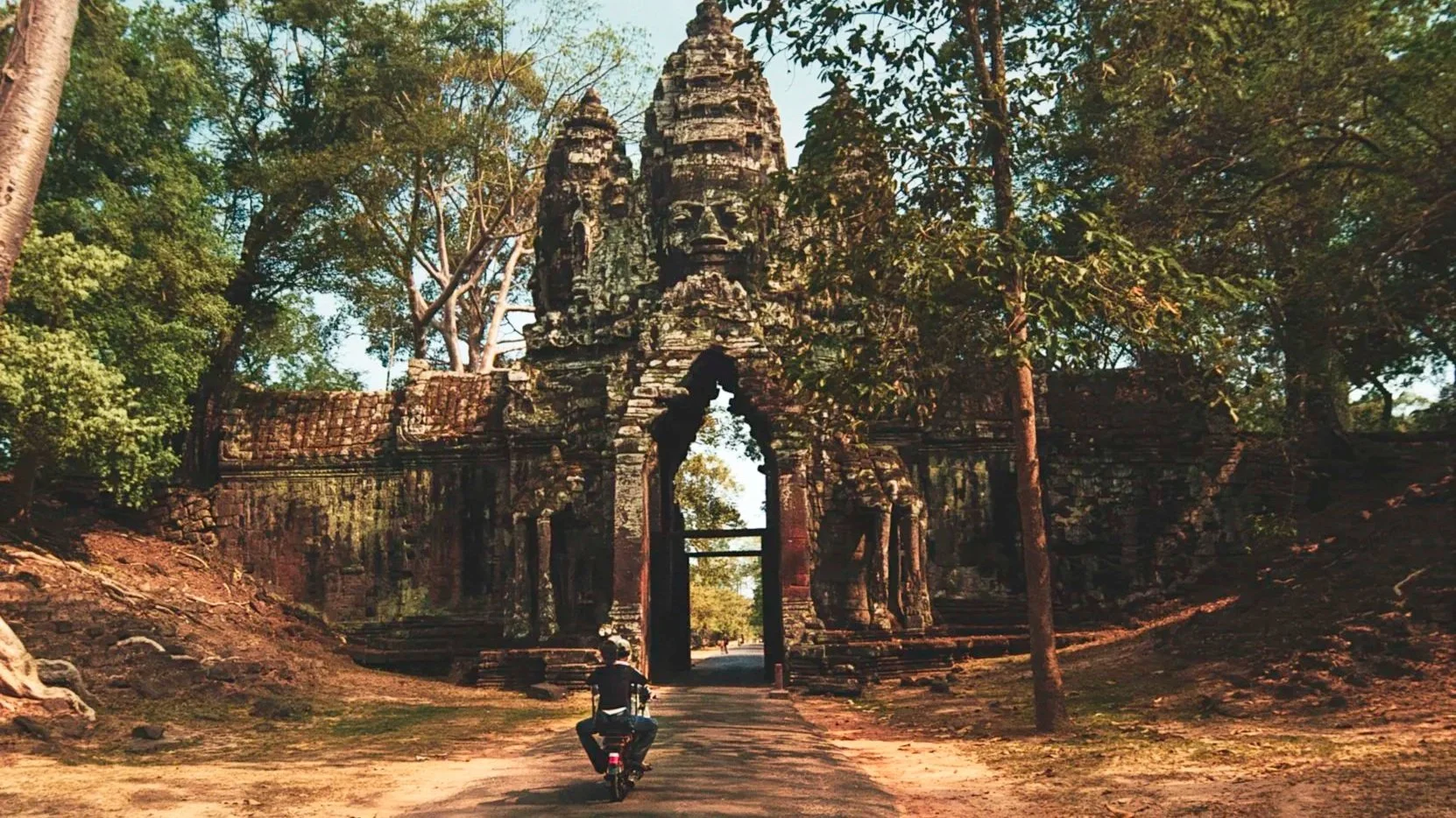 angkor-thom-south-gate-cambodia-traveler-motorbike-ancient-architecture.jpg