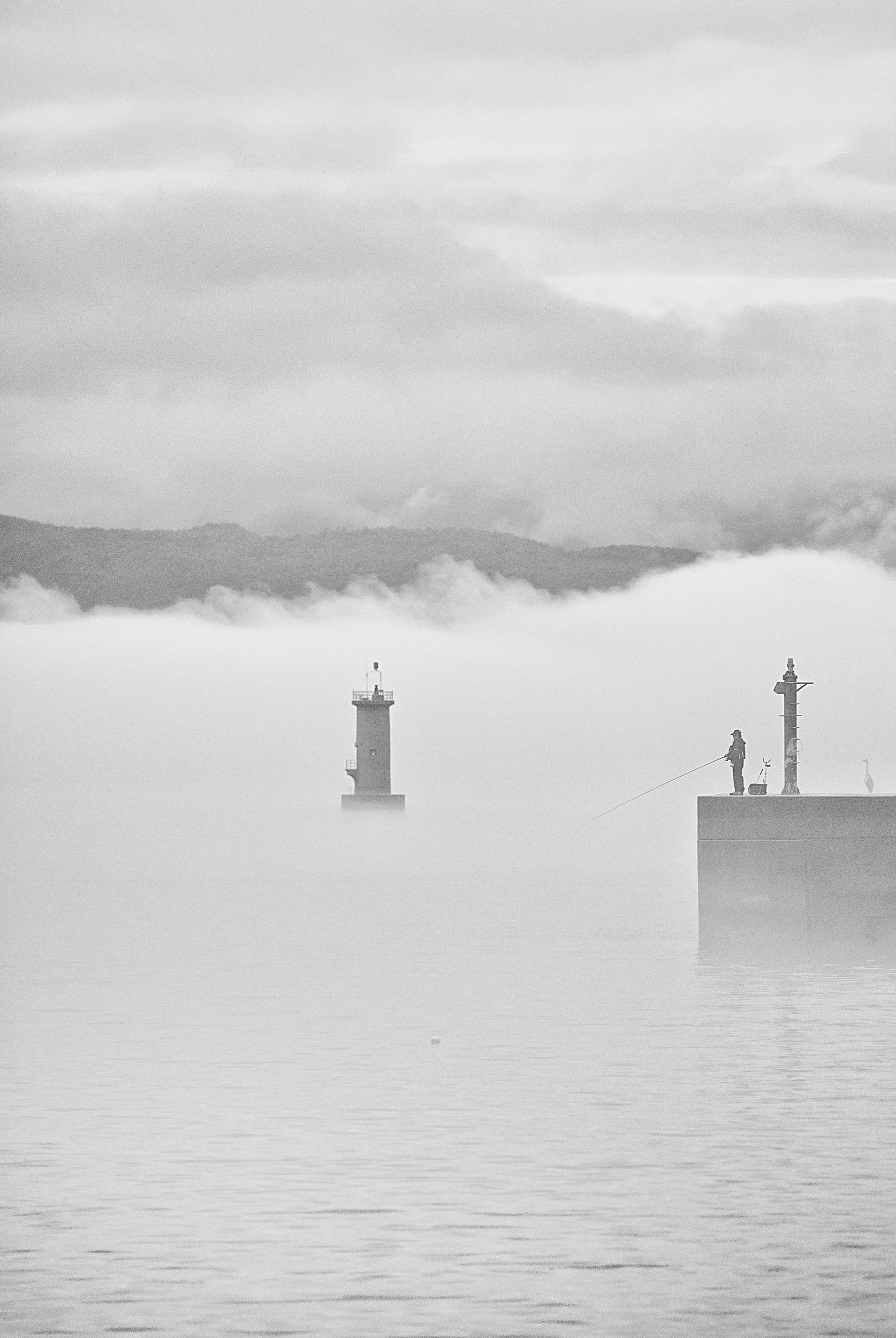 ignacio-ayestaran-naoshima-green-lighthouse-fisherman-mist-bw.jpg