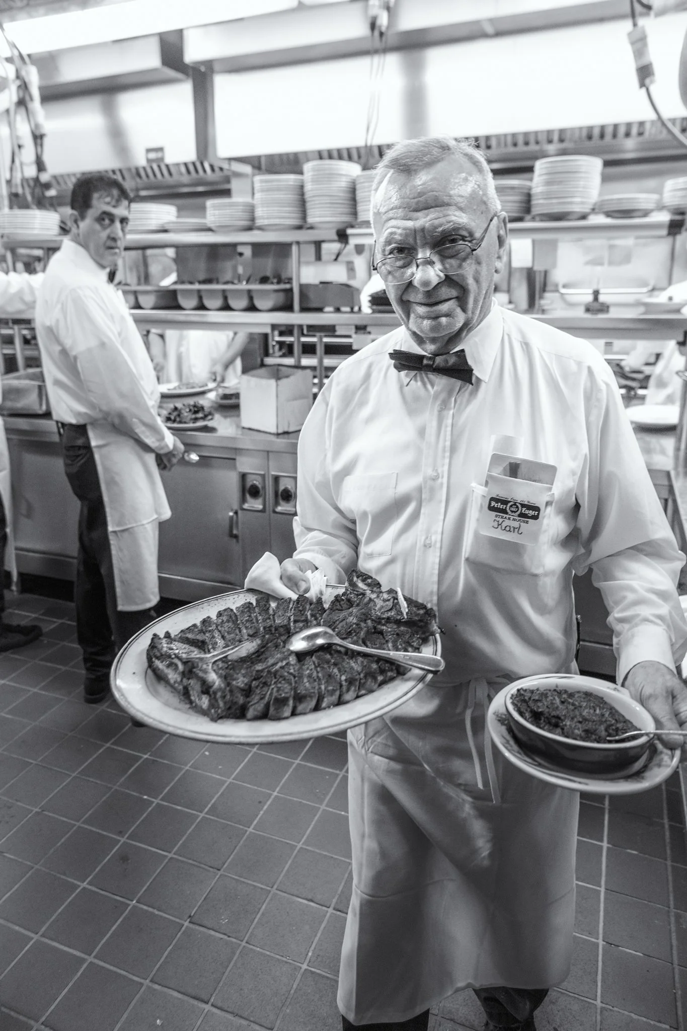 peter-luger-waiter-serving-steak-brooklyn.jpg