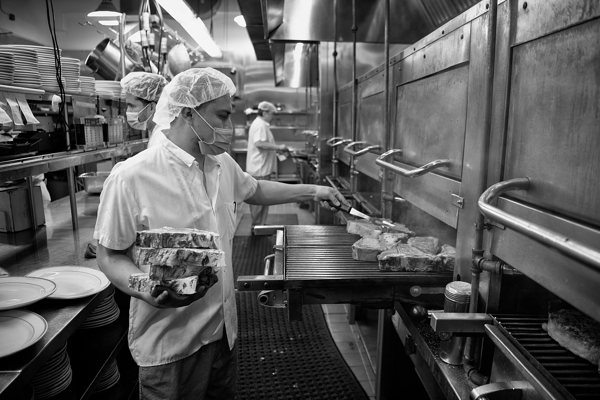 peter-luger-grill-station-staff-cooking-steak.jpg