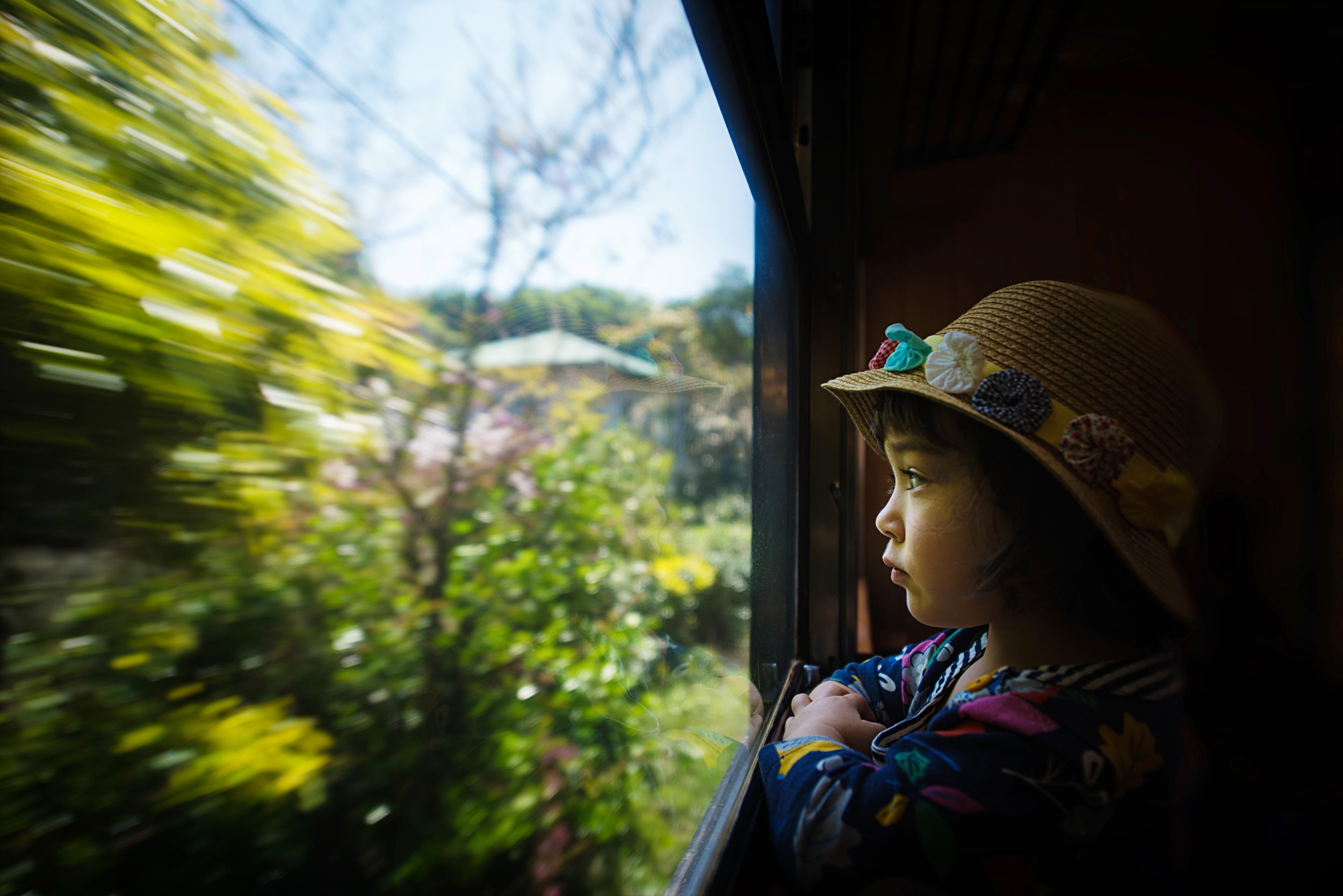 child-train-window-Japan-travel-motion-blur-reflection.jpg