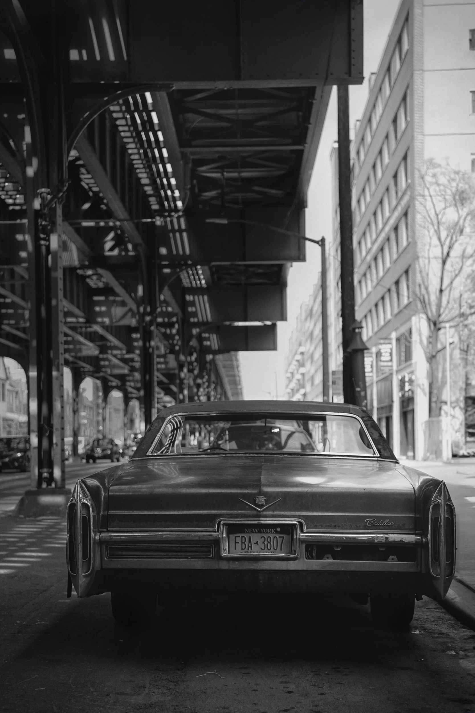 1968-cadillac-coupe-deville-new-york-street-black-white.jpg