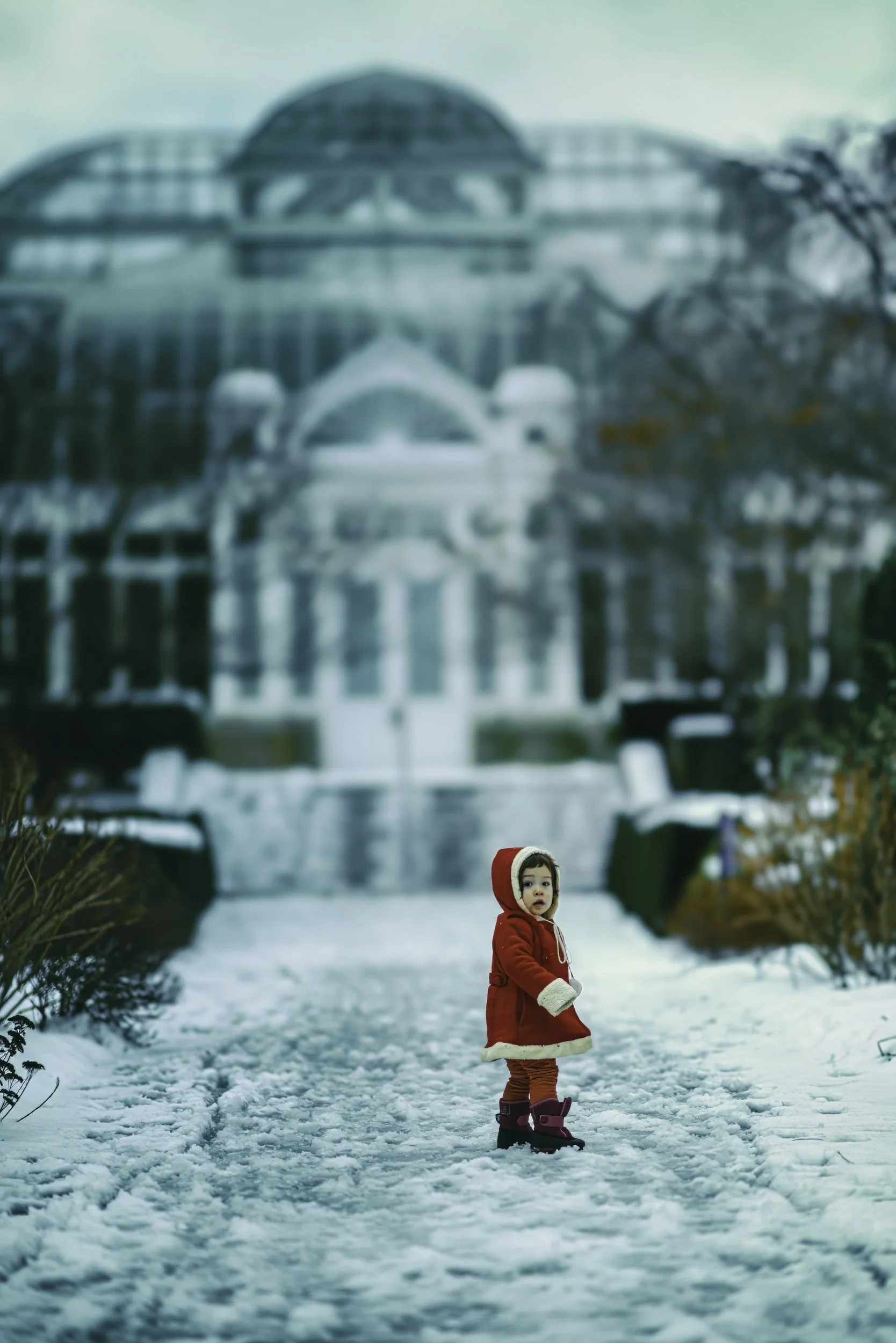 red-coat-child-ice-palace-winter.jpg
