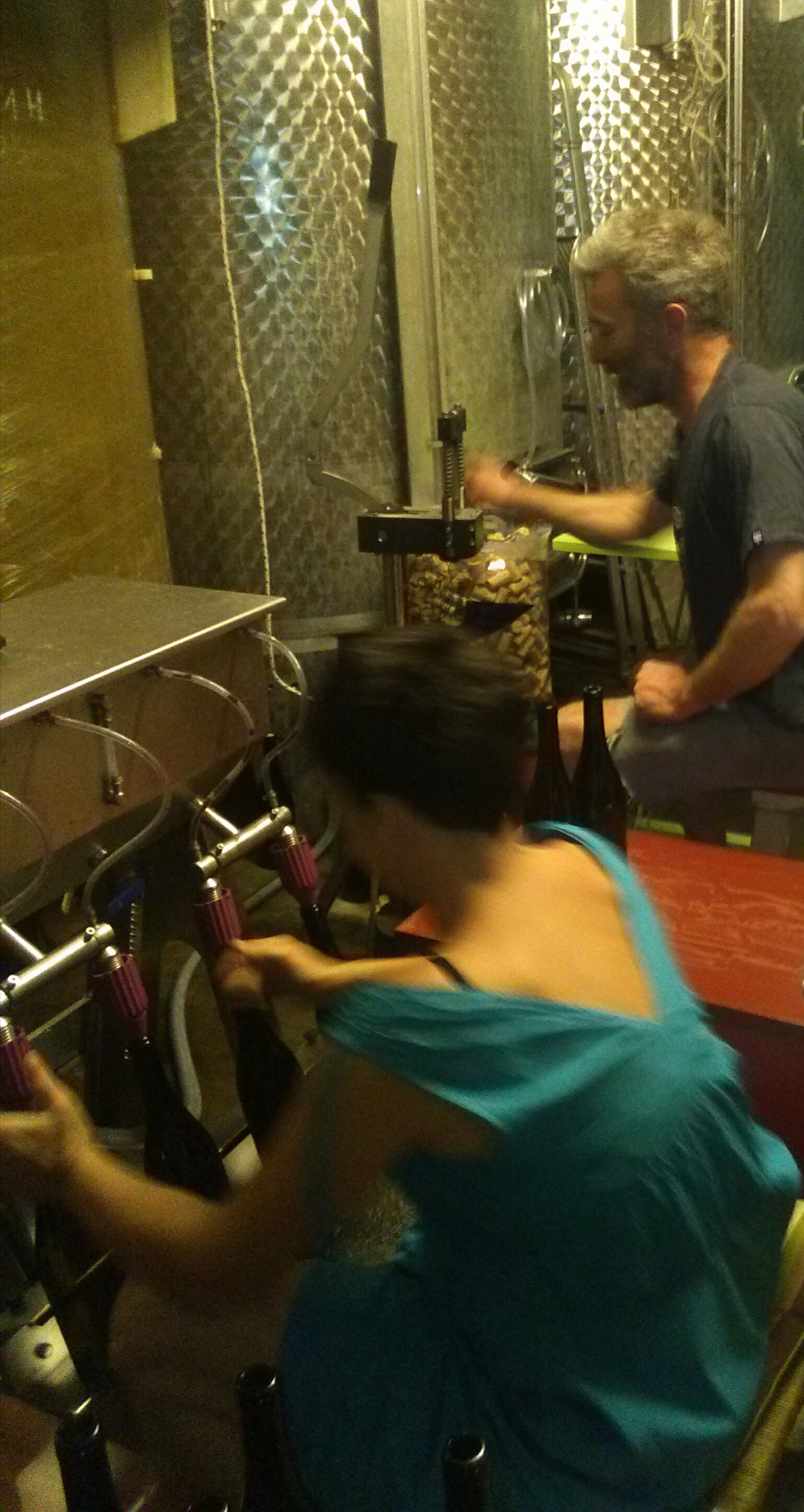 Agnès & Philippe bottling by hand