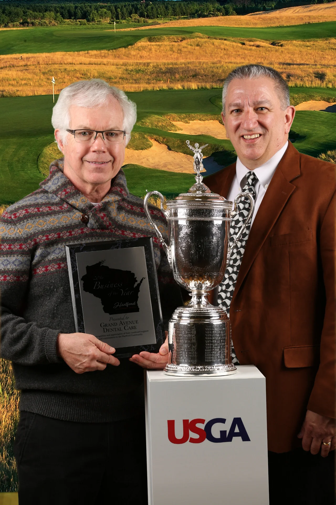 Dr. Wilk, Hartford Chamber of Commerce Director, Scott Henke, and the U.S. Open Trophy, which was on display at the Annual Dinner!