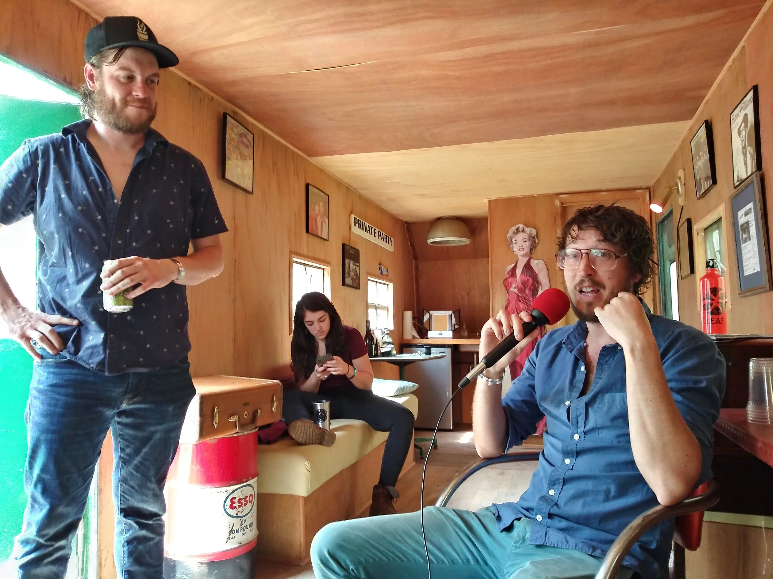 Noah Jeffries (L) looks on as Alan Eckert (R) of The Deer talks about how artists can best use SXSW to their advantage.